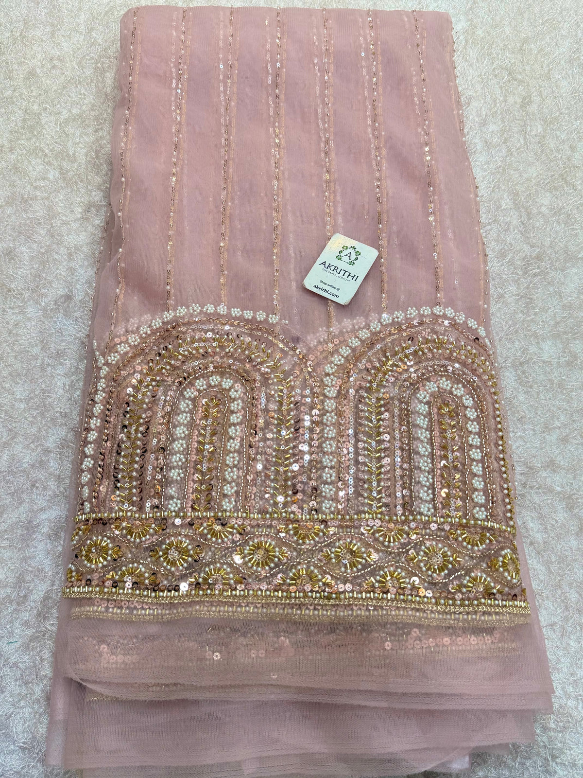 Embroidered net fabric