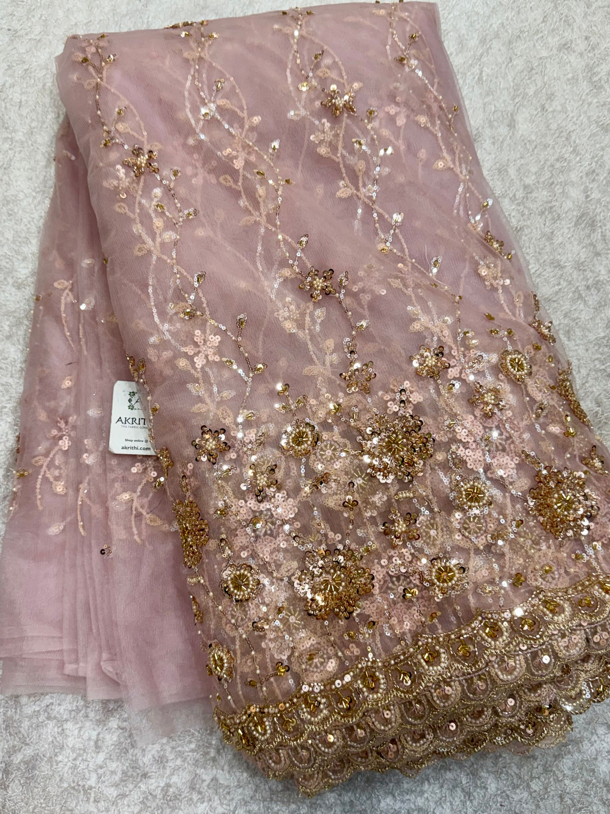 Embroidered net fabric