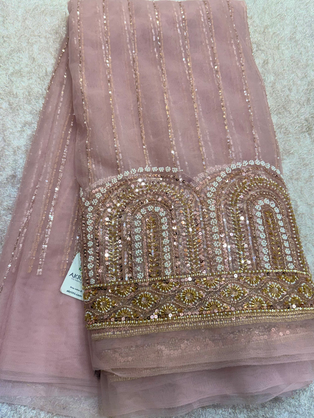Embroidered net fabric