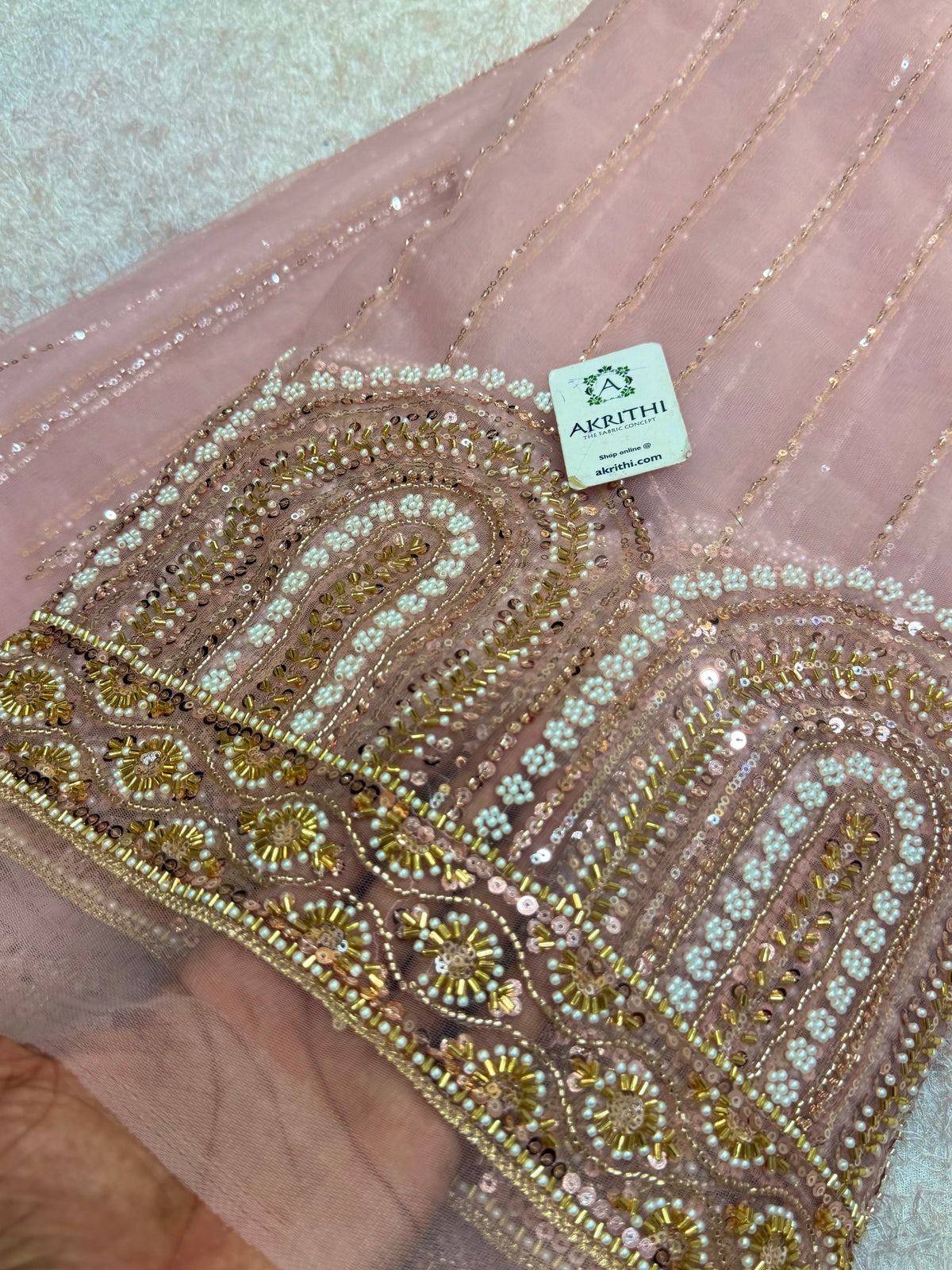 Embroidered net fabric