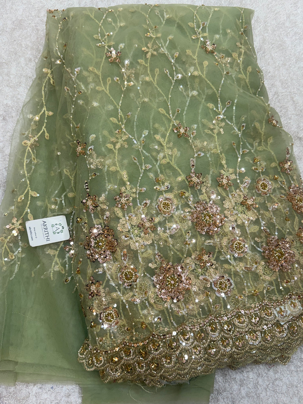 Embroidered net fabric