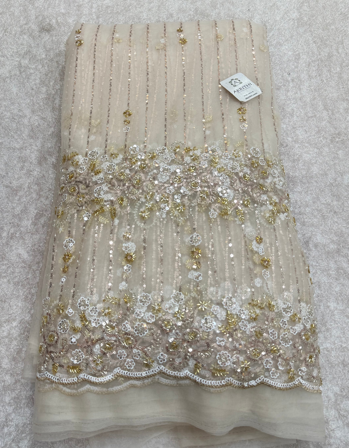Embroidered net fabric