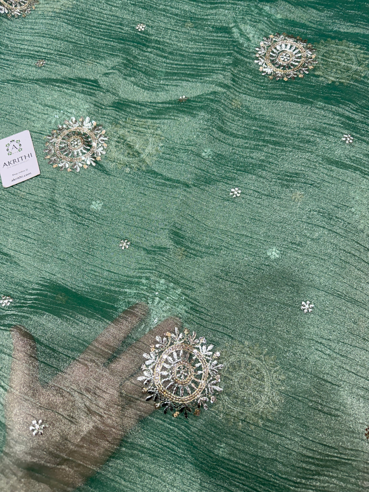 Embroidered crushed tissue fabric