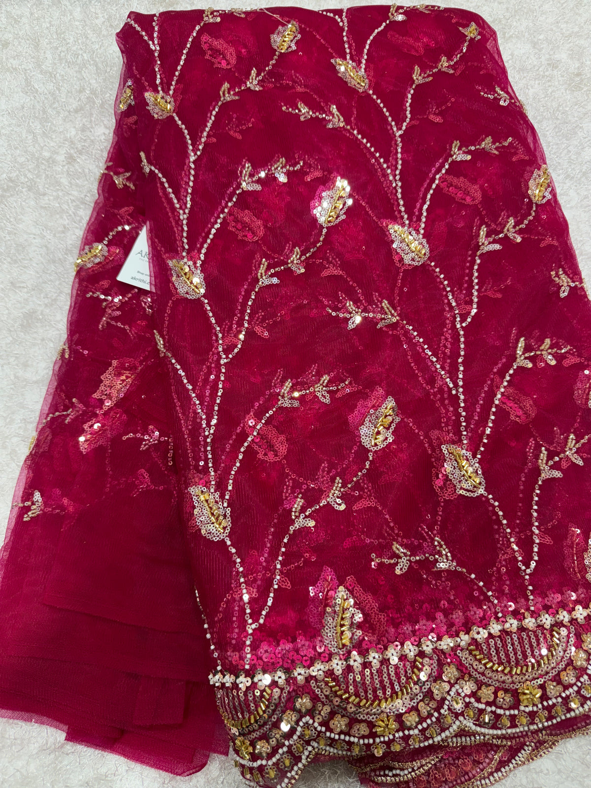 Embroidered net fabric