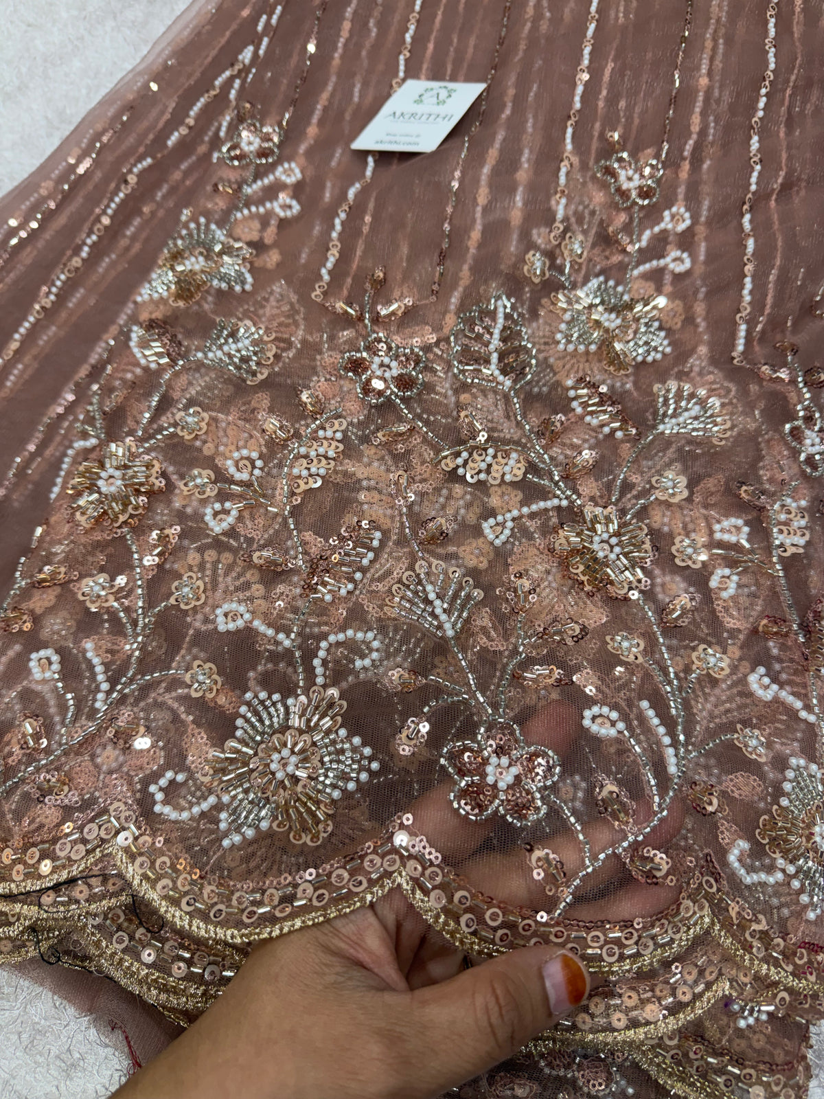 Embroidered net fabric