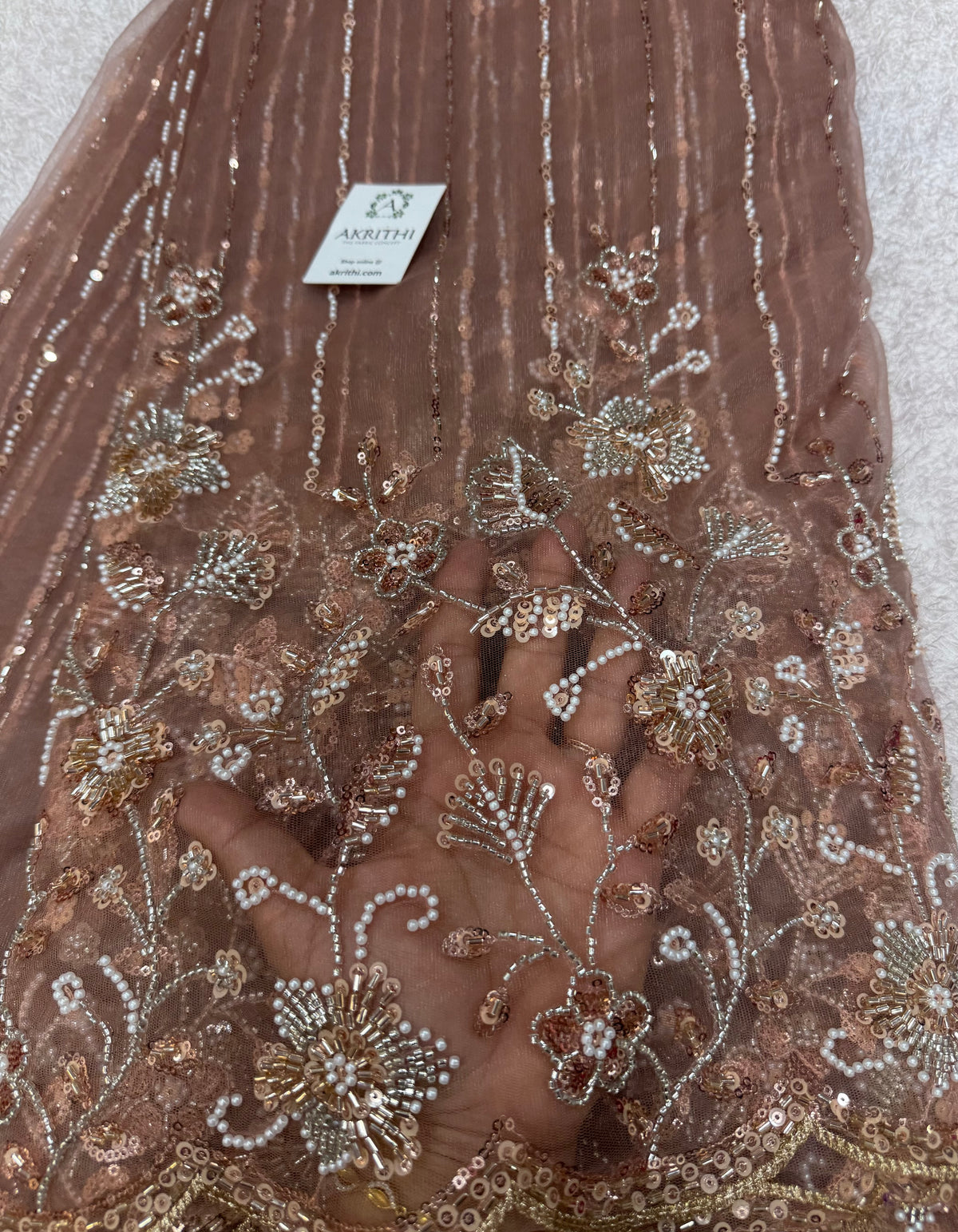 Embroidered net fabric