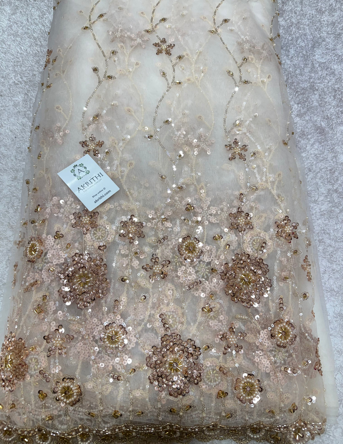 Embroidered net fabric