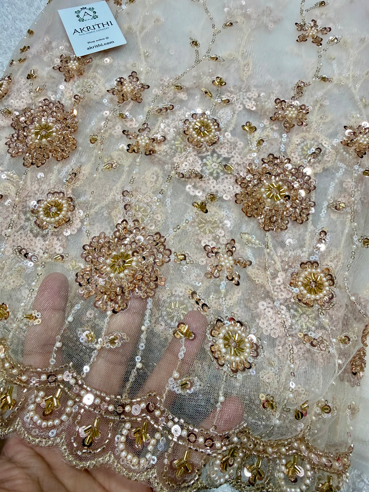Embroidered net fabric