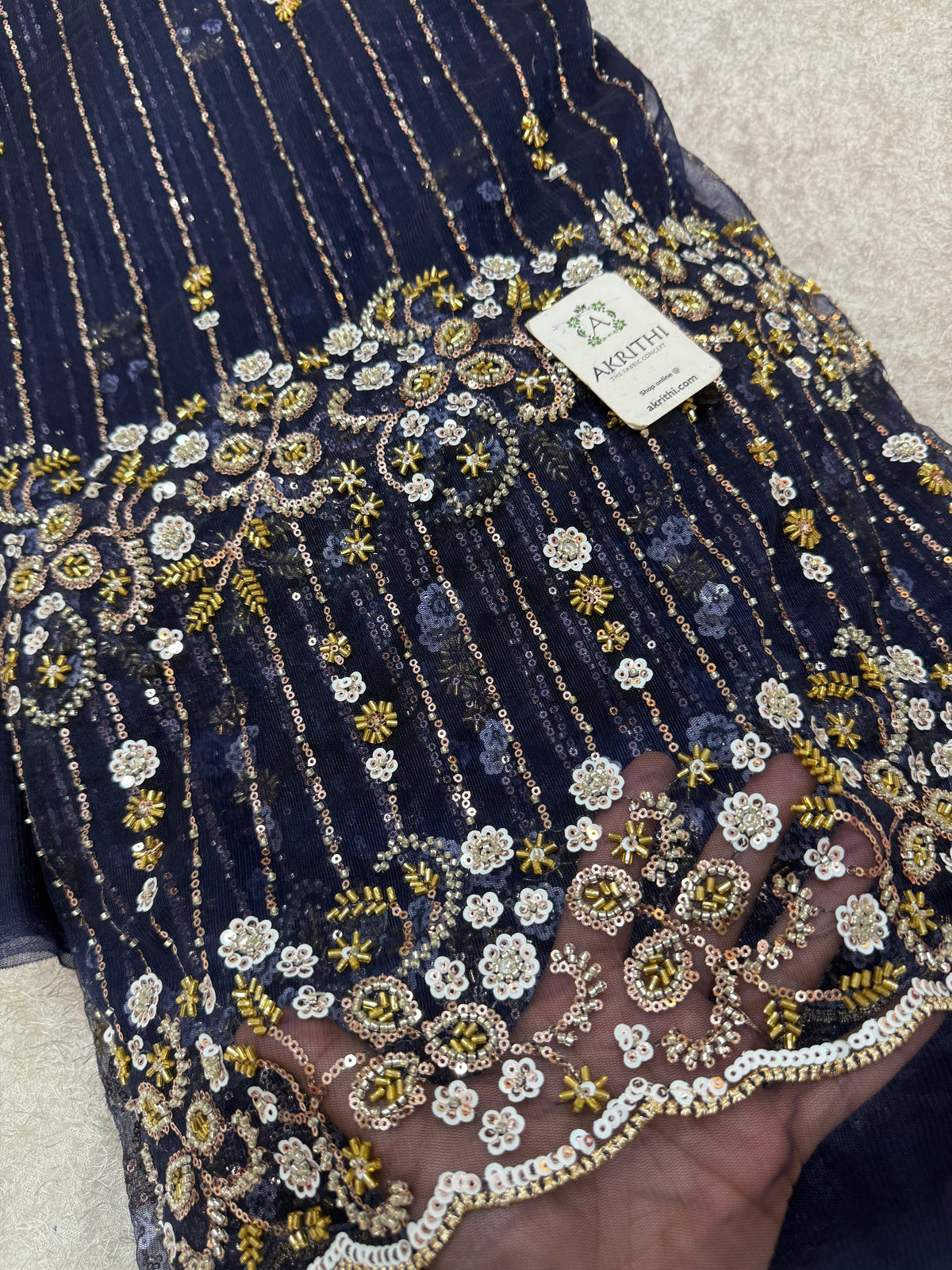 Embroidered net fabric