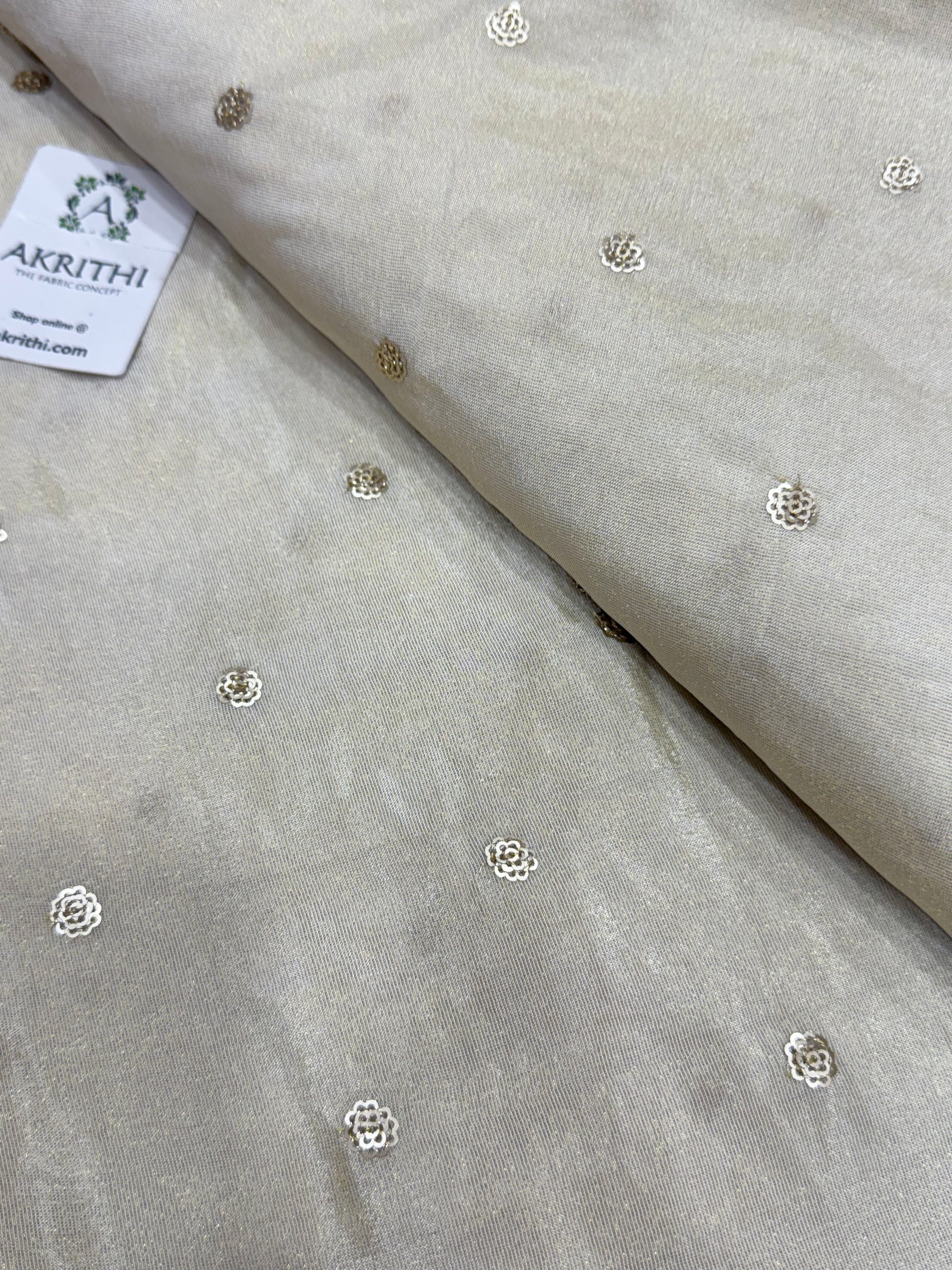 Sequins on dyeable crepe tissue fabric