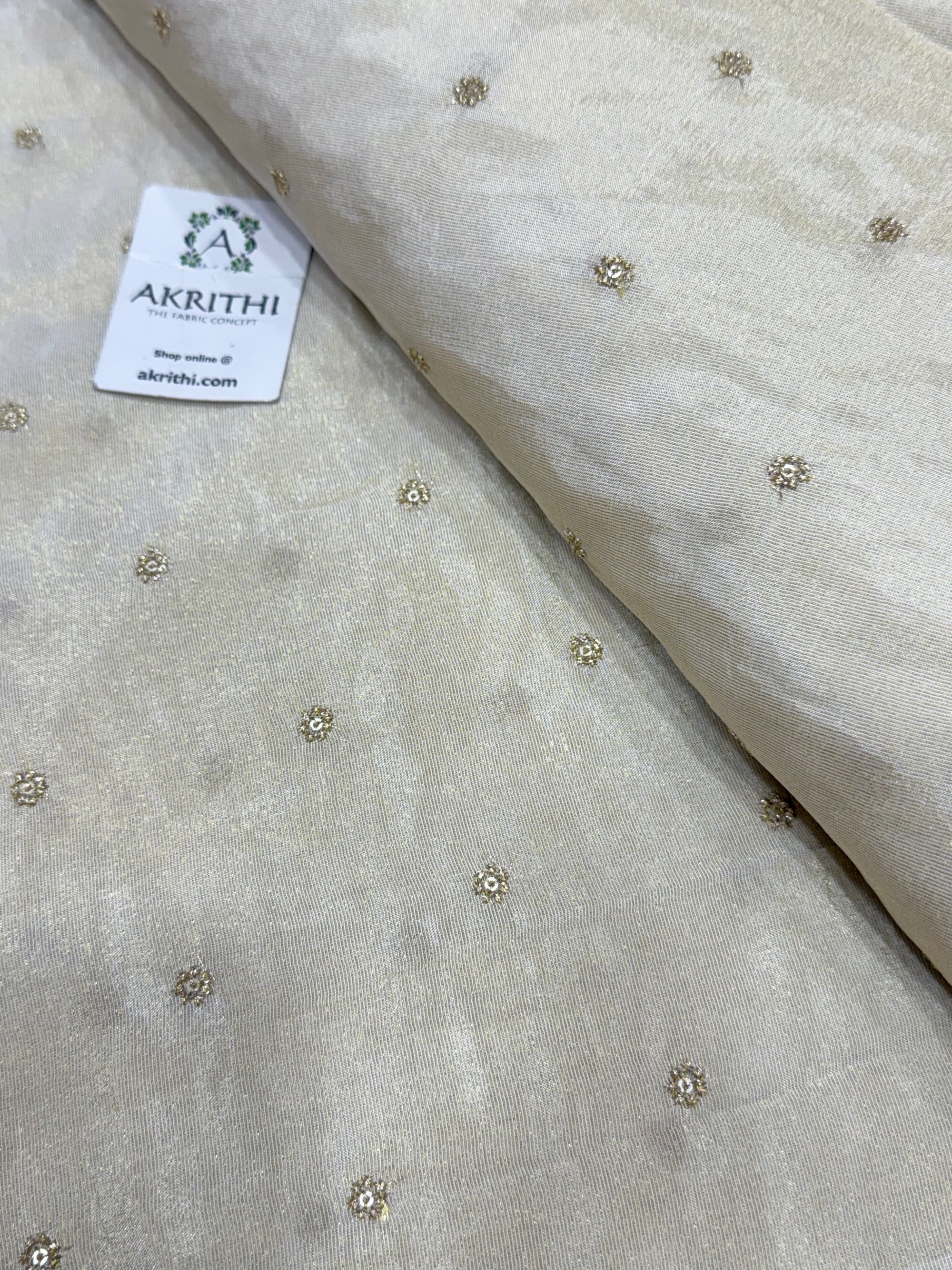 Sequins on dyeable crepe tissue fabric