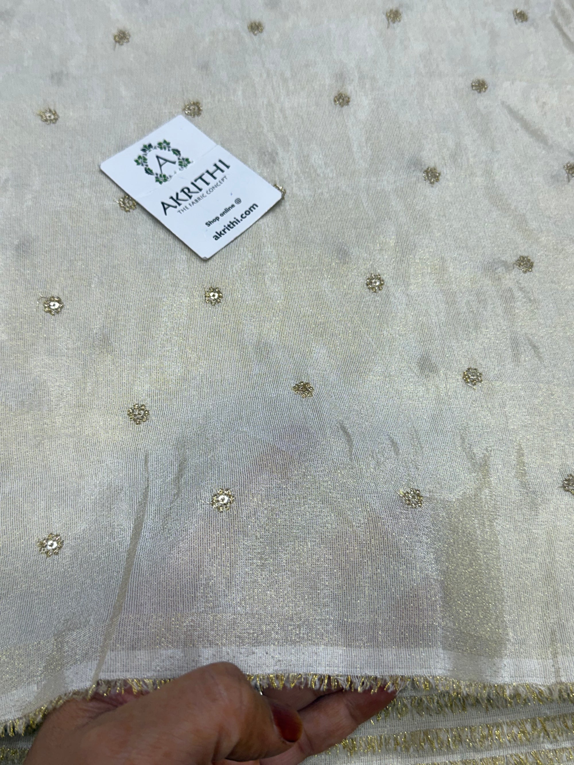 Sequins on dyeable crepe tissue fabric