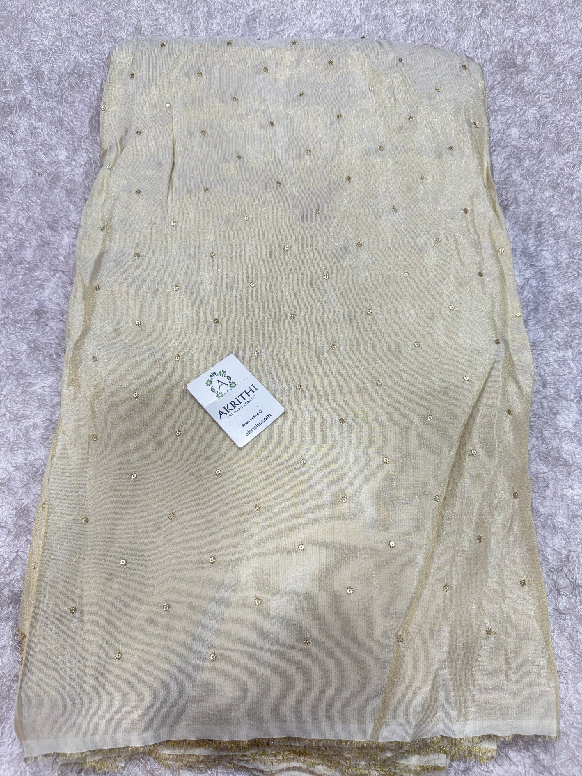 Sequins on dyeable crepe tissue fabric