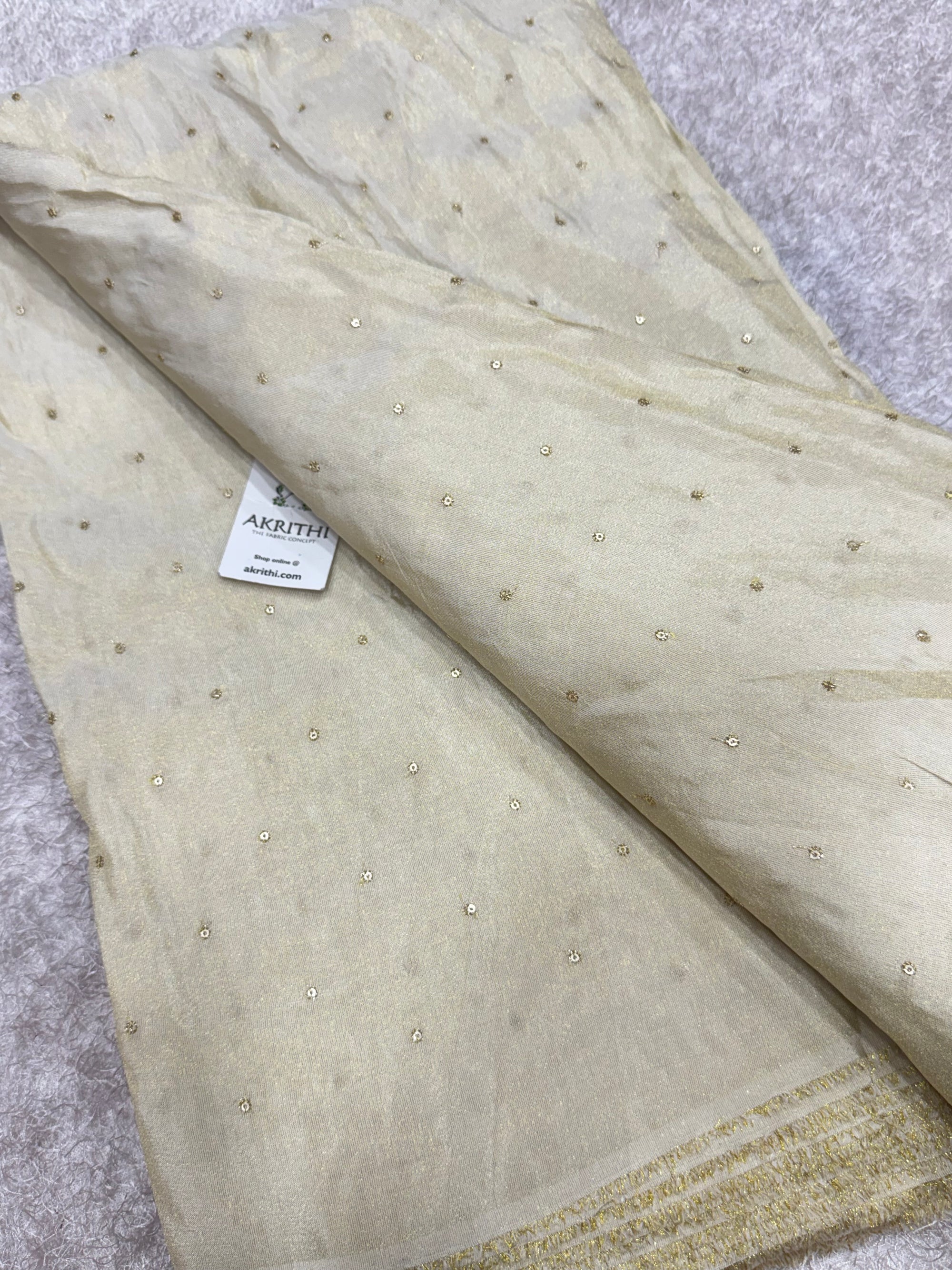 Sequins on dyeable crepe tissue fabric