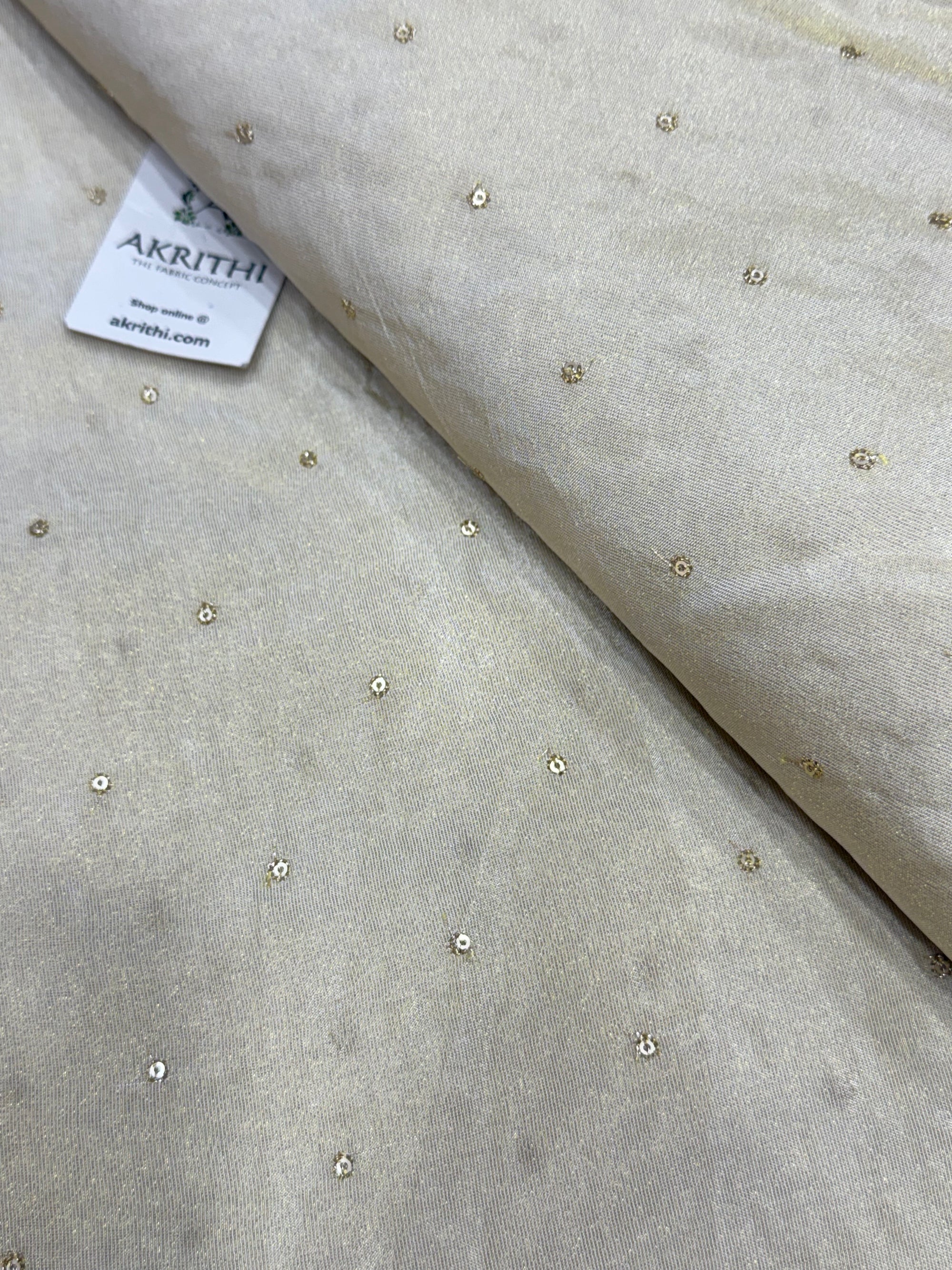 Sequins on dyeable crepe tissue fabric