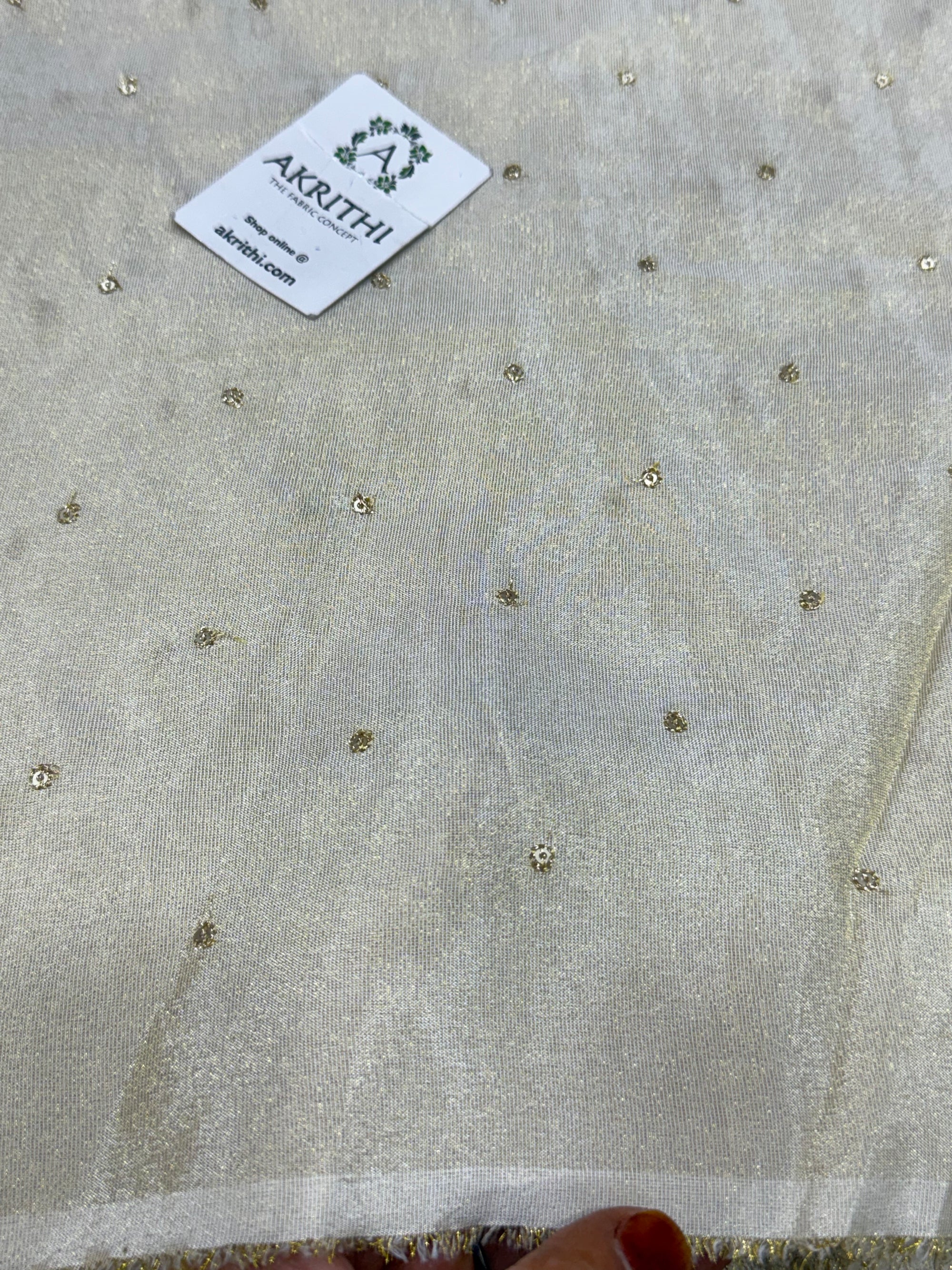 Sequins on dyeable crepe tissue fabric