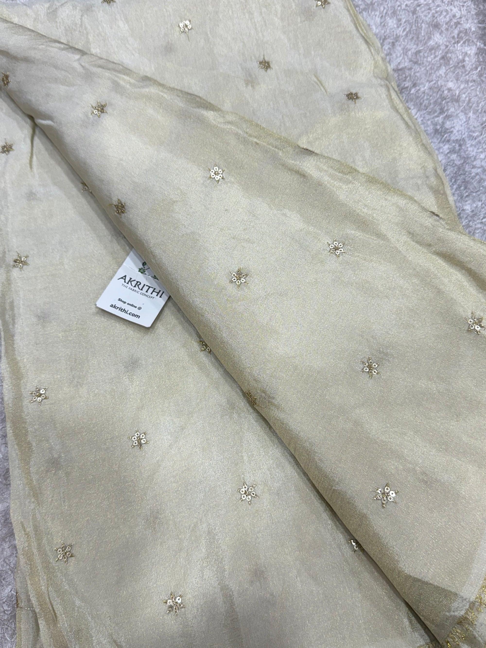 Sequins on dyeable crepe tissue fabric