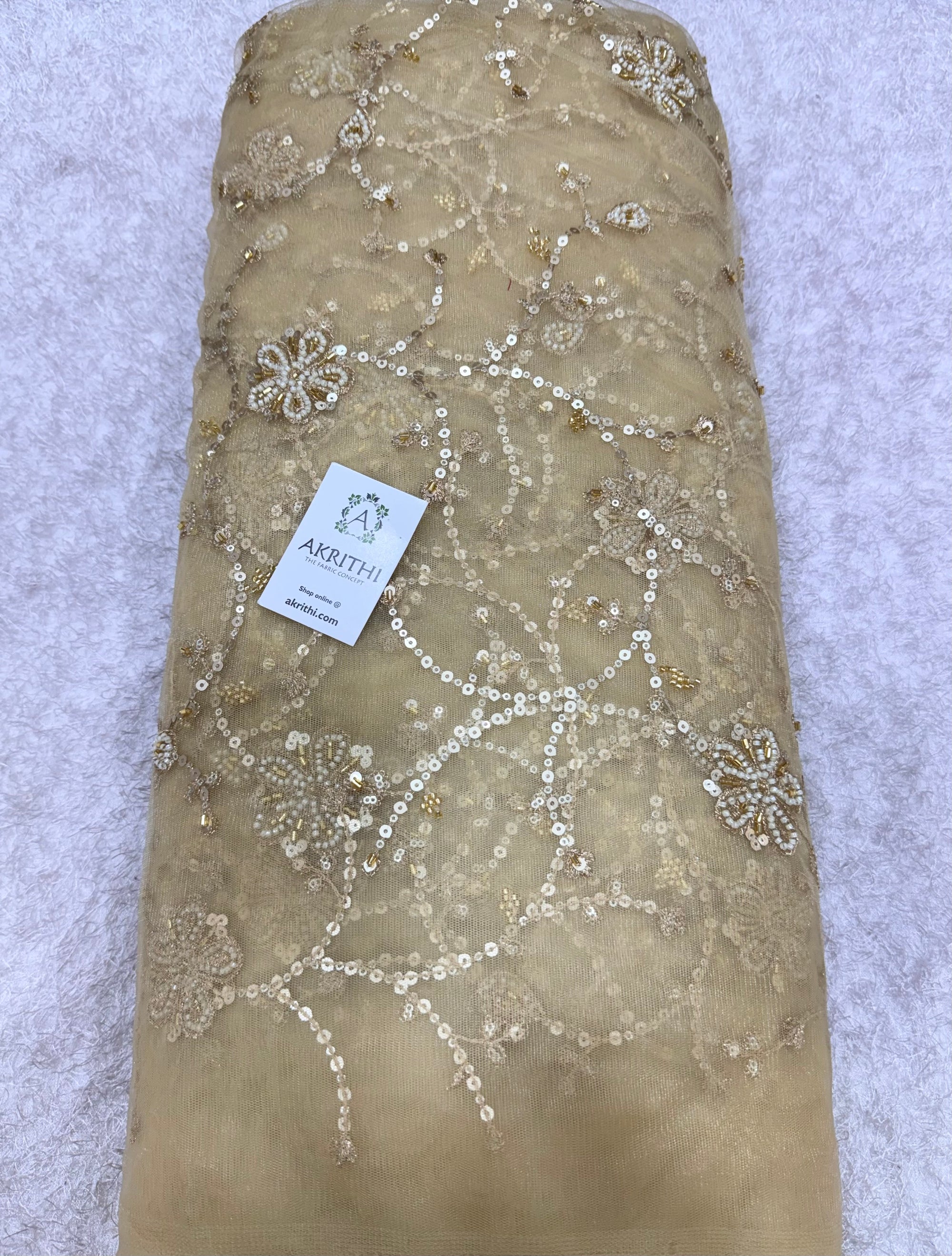 Embroidered gold net fabric