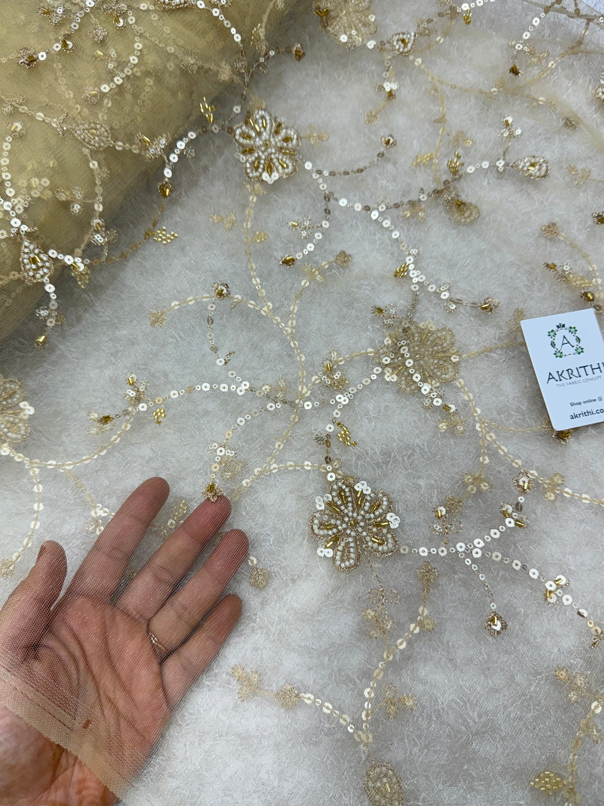 Embroidered gold net fabric