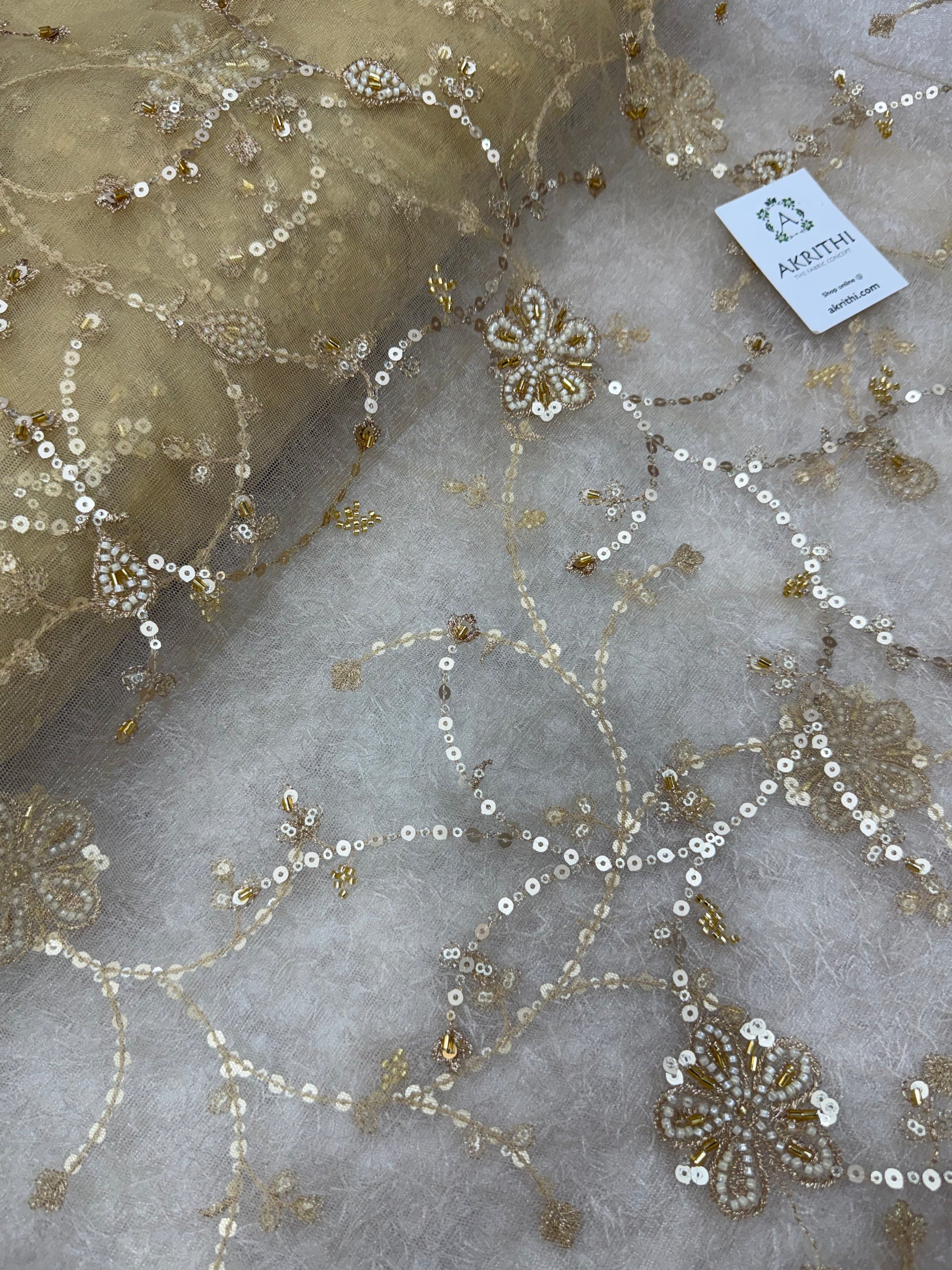 Embroidered gold net fabric