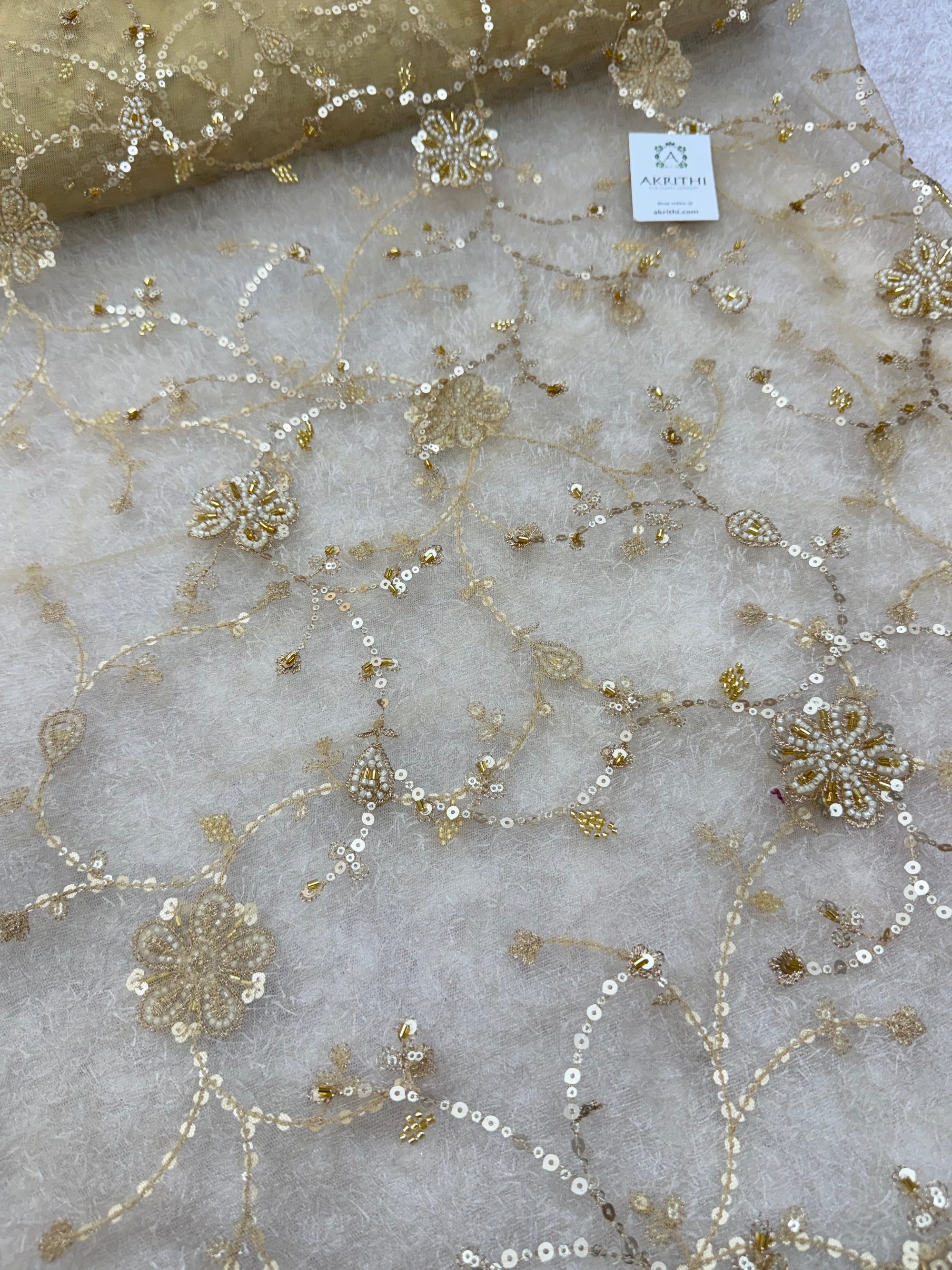 Embroidered gold net fabric