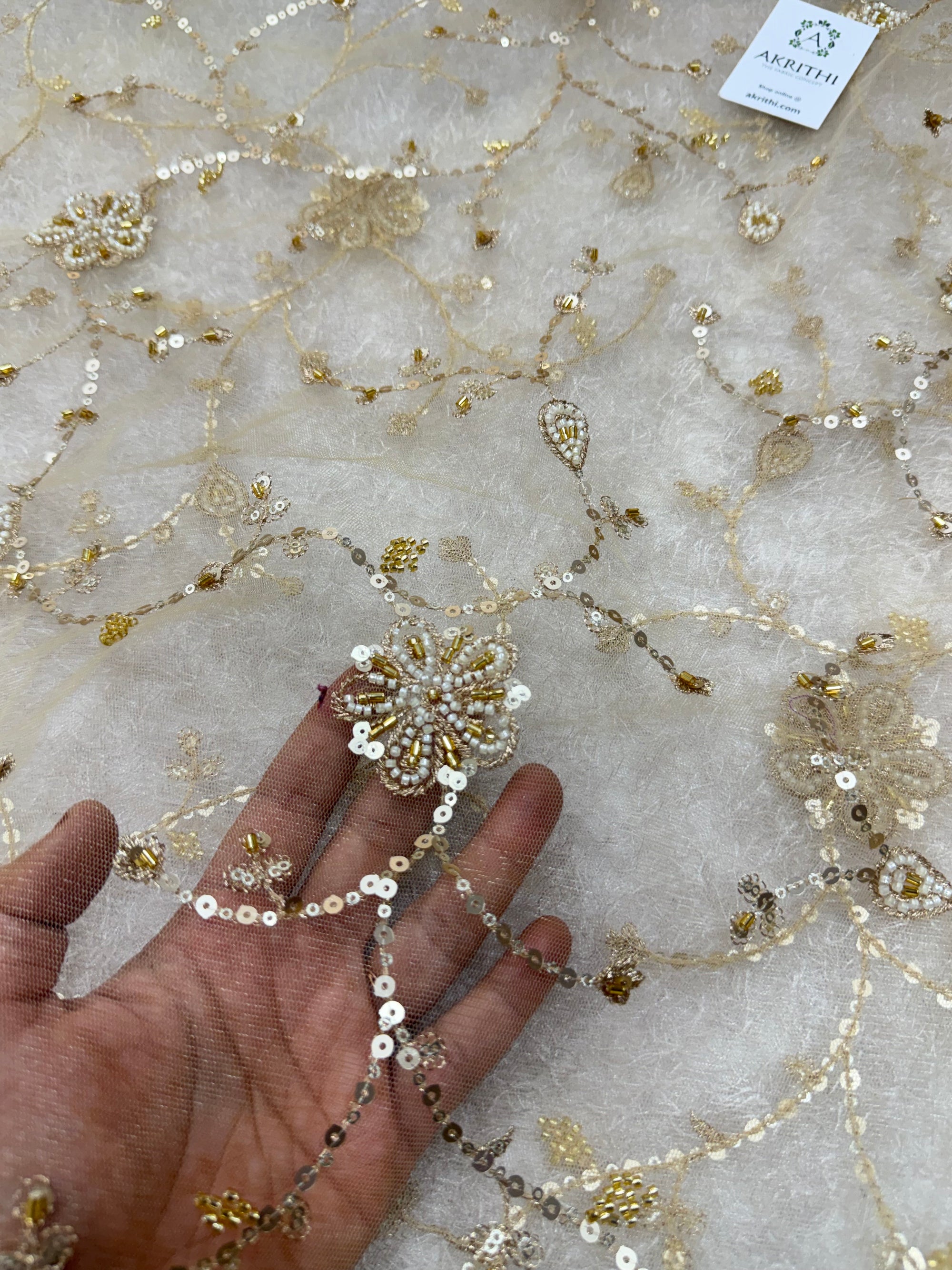Embroidered gold net fabric
