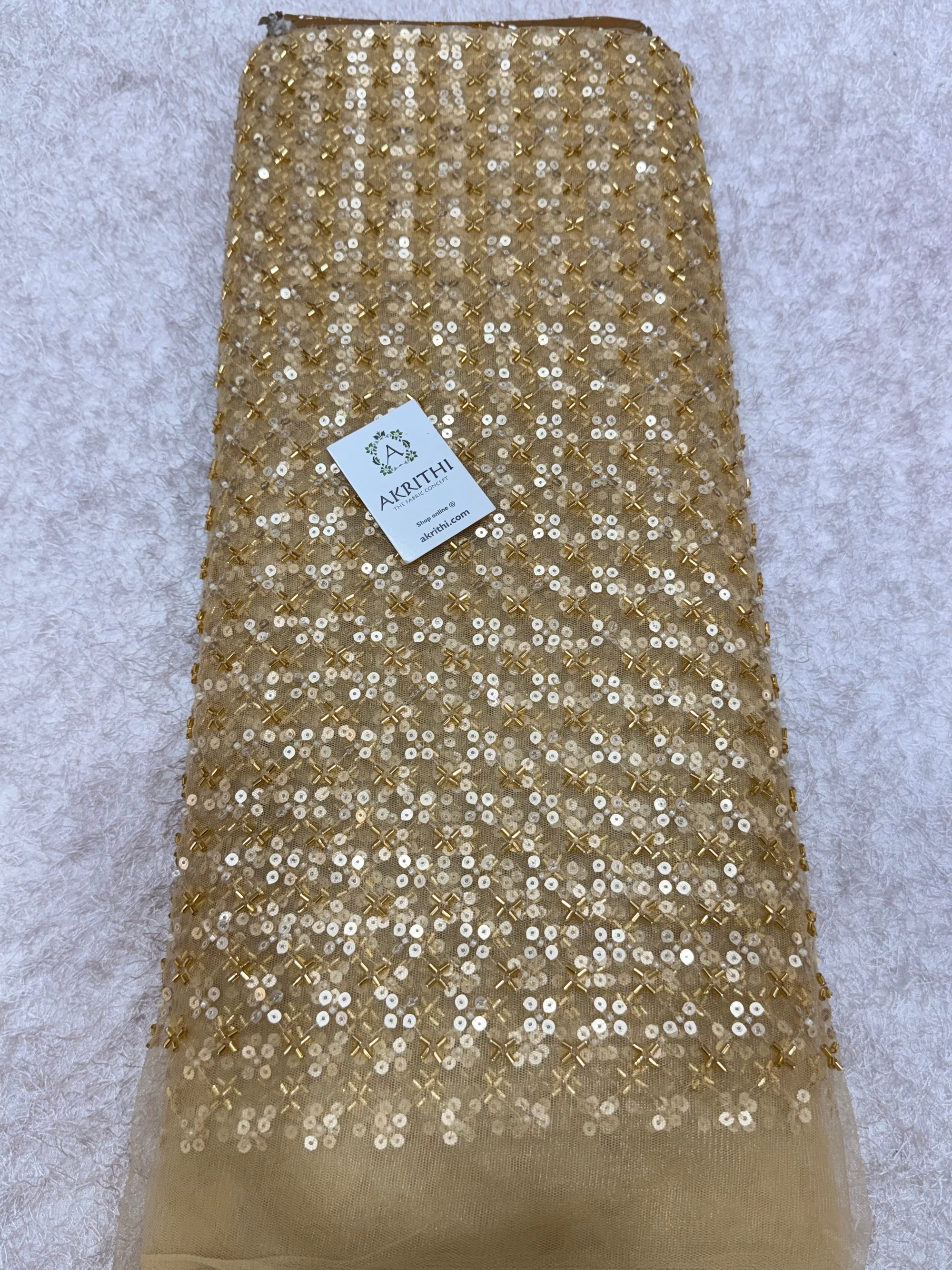 Embroidered gold net fabric