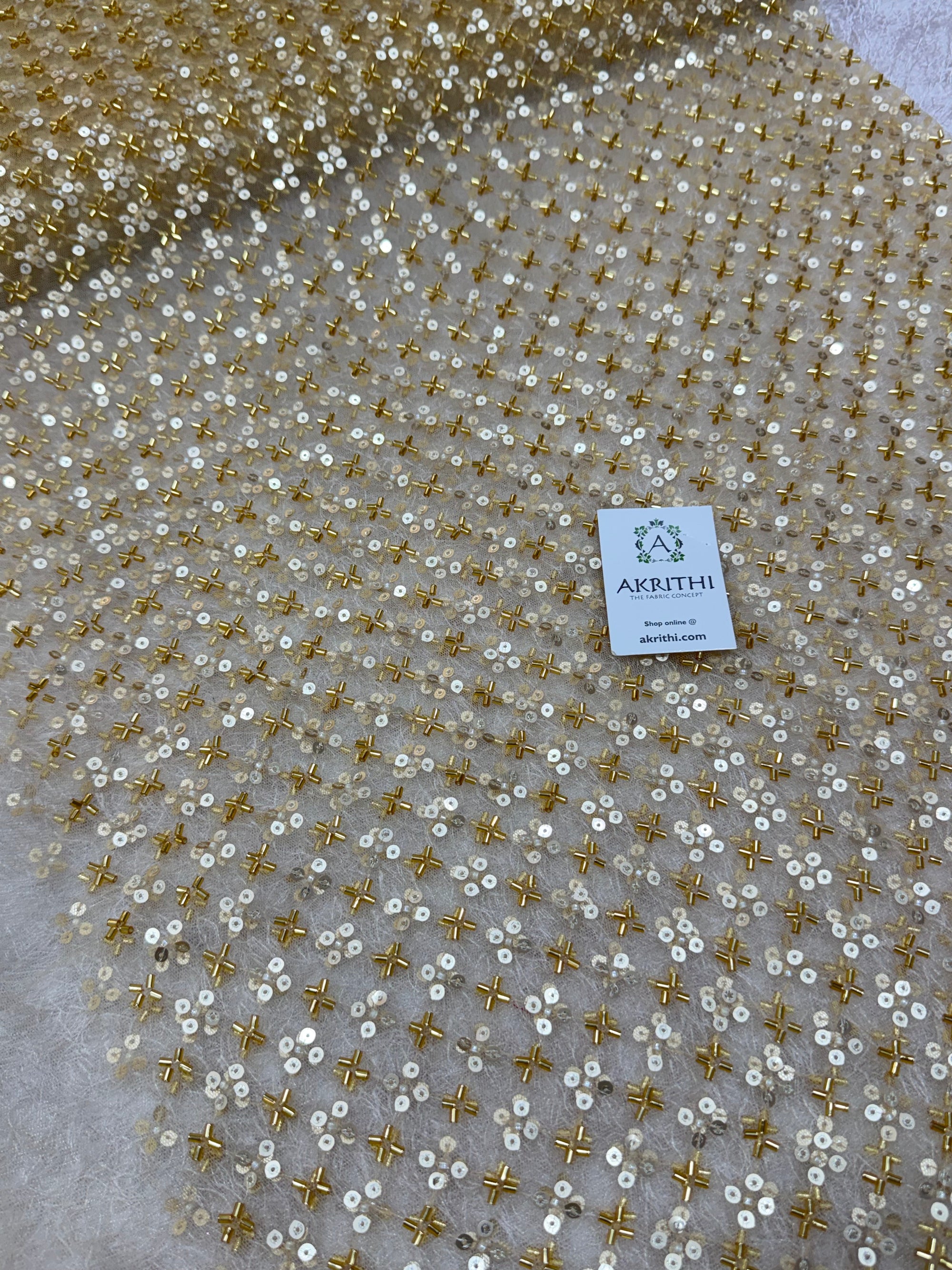 Embroidered gold net fabric