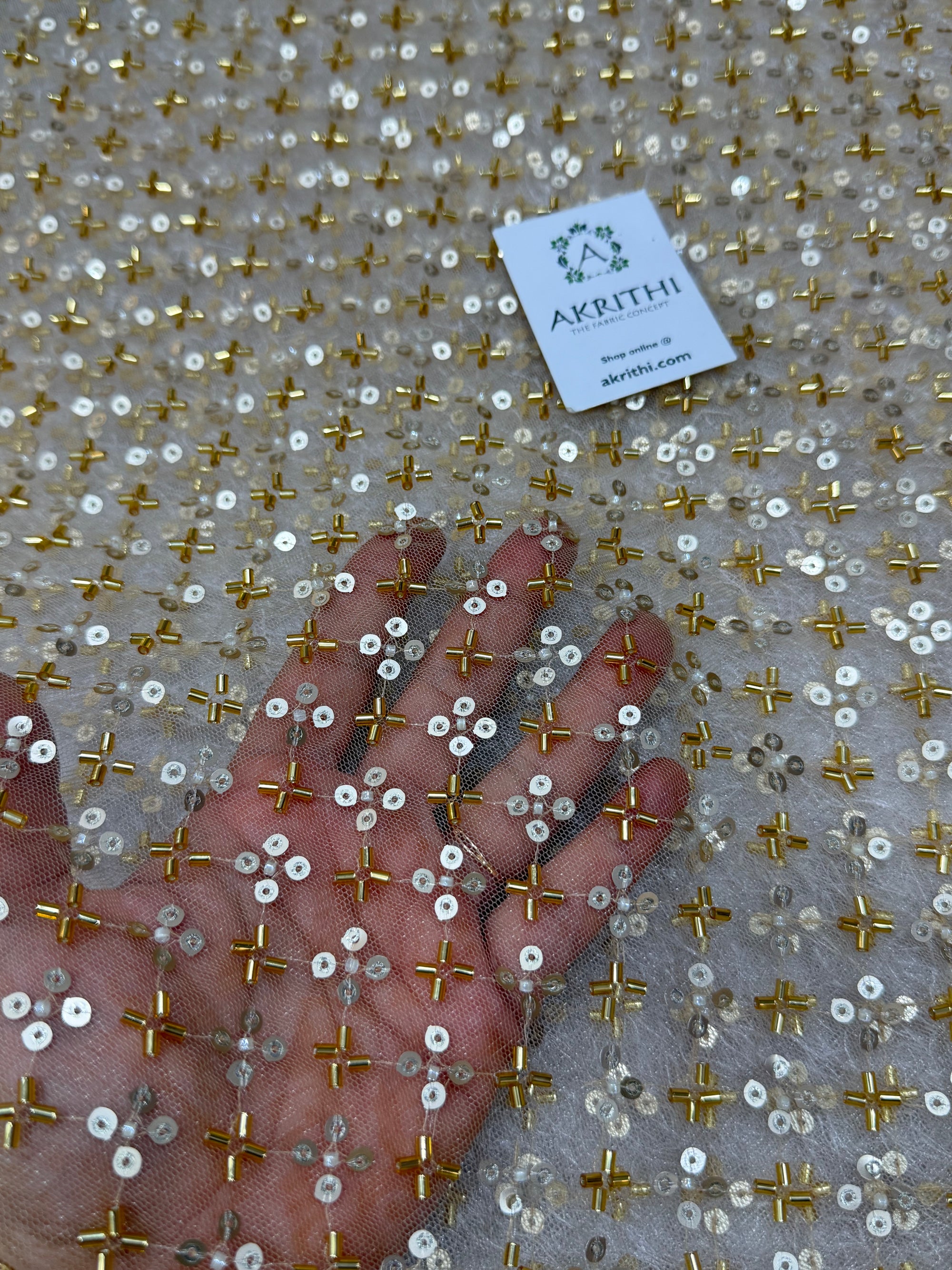 Embroidered gold net fabric
