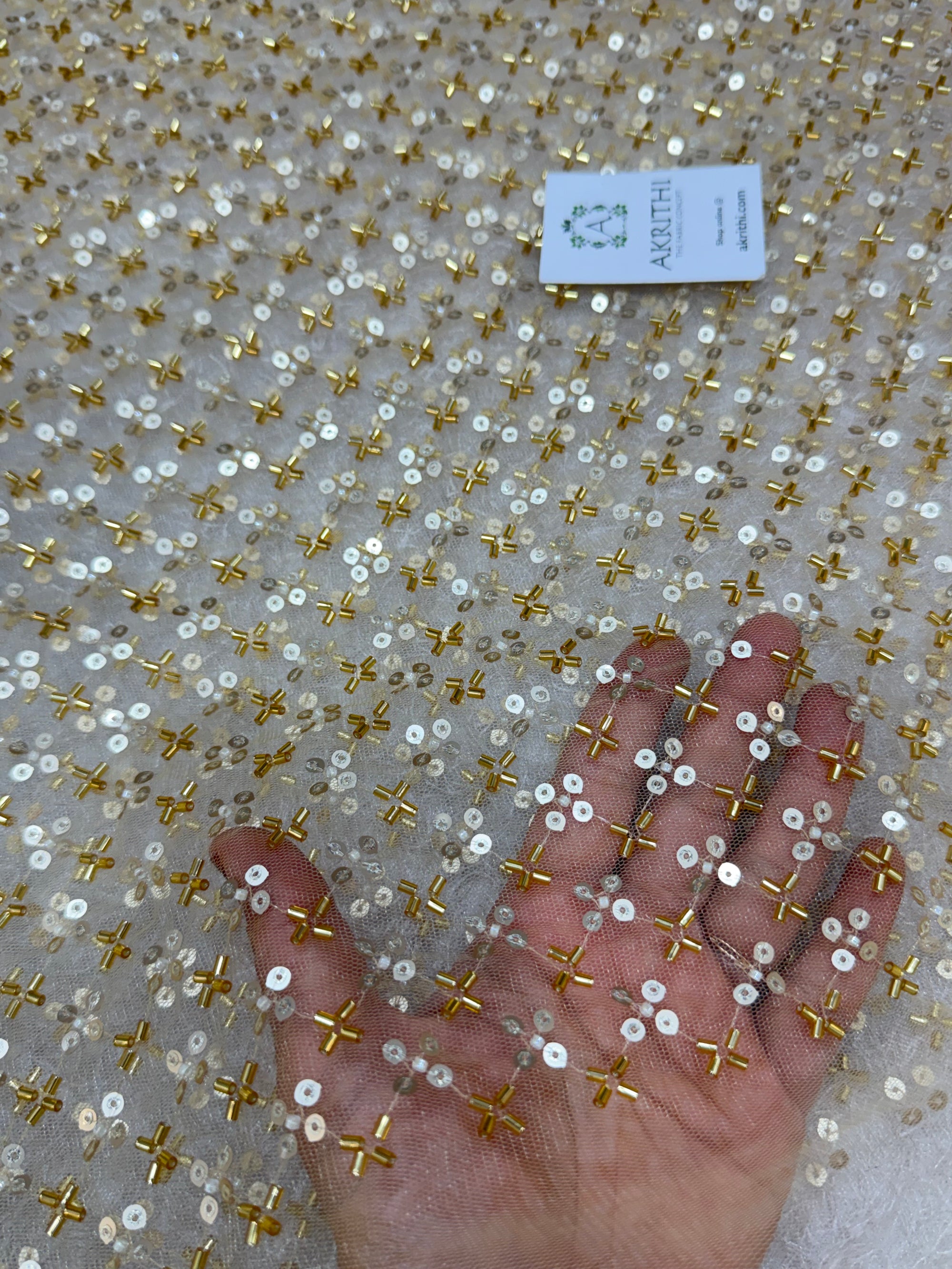 Embroidered gold net fabric