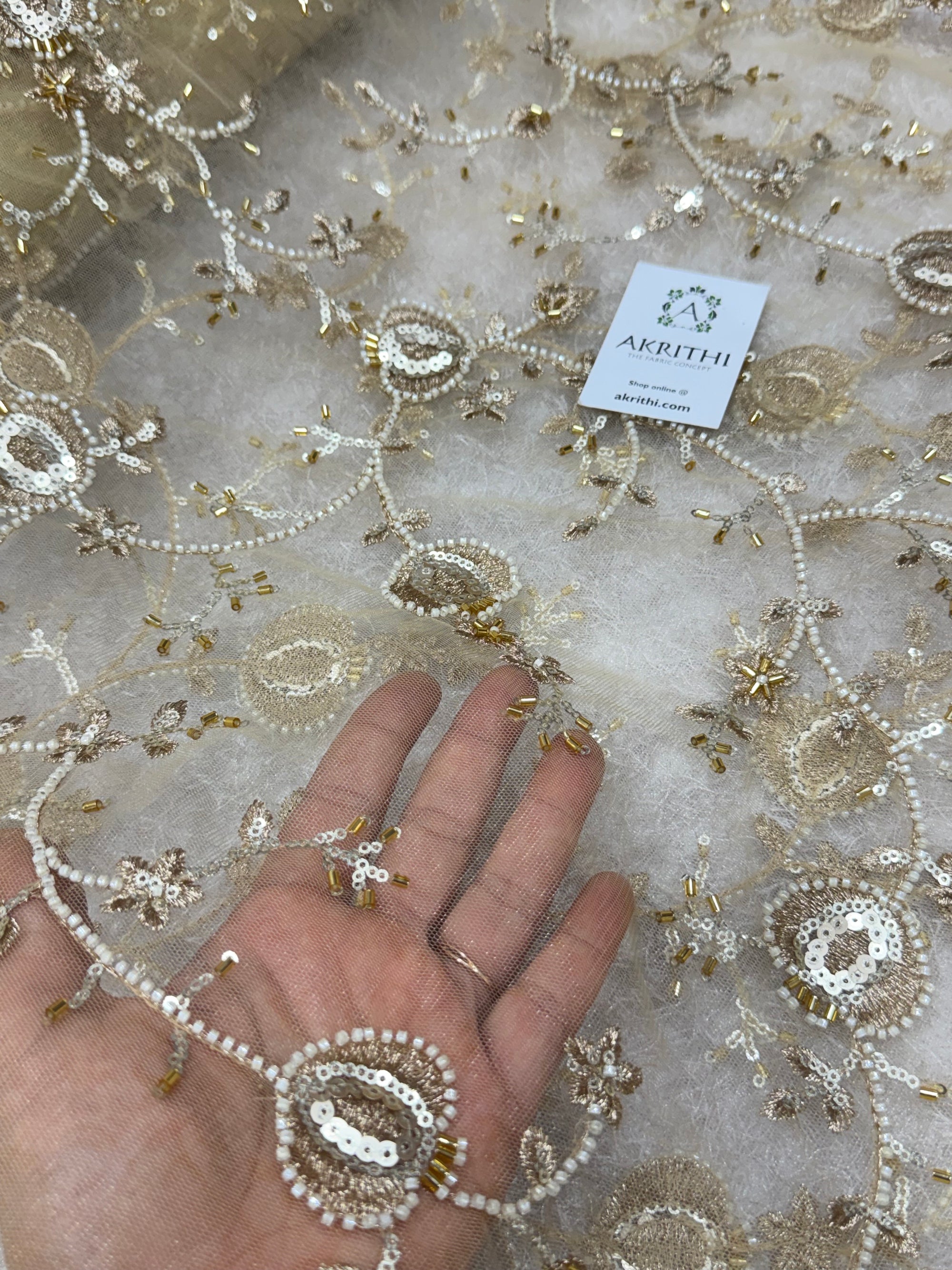 Embroidered gold net fabric