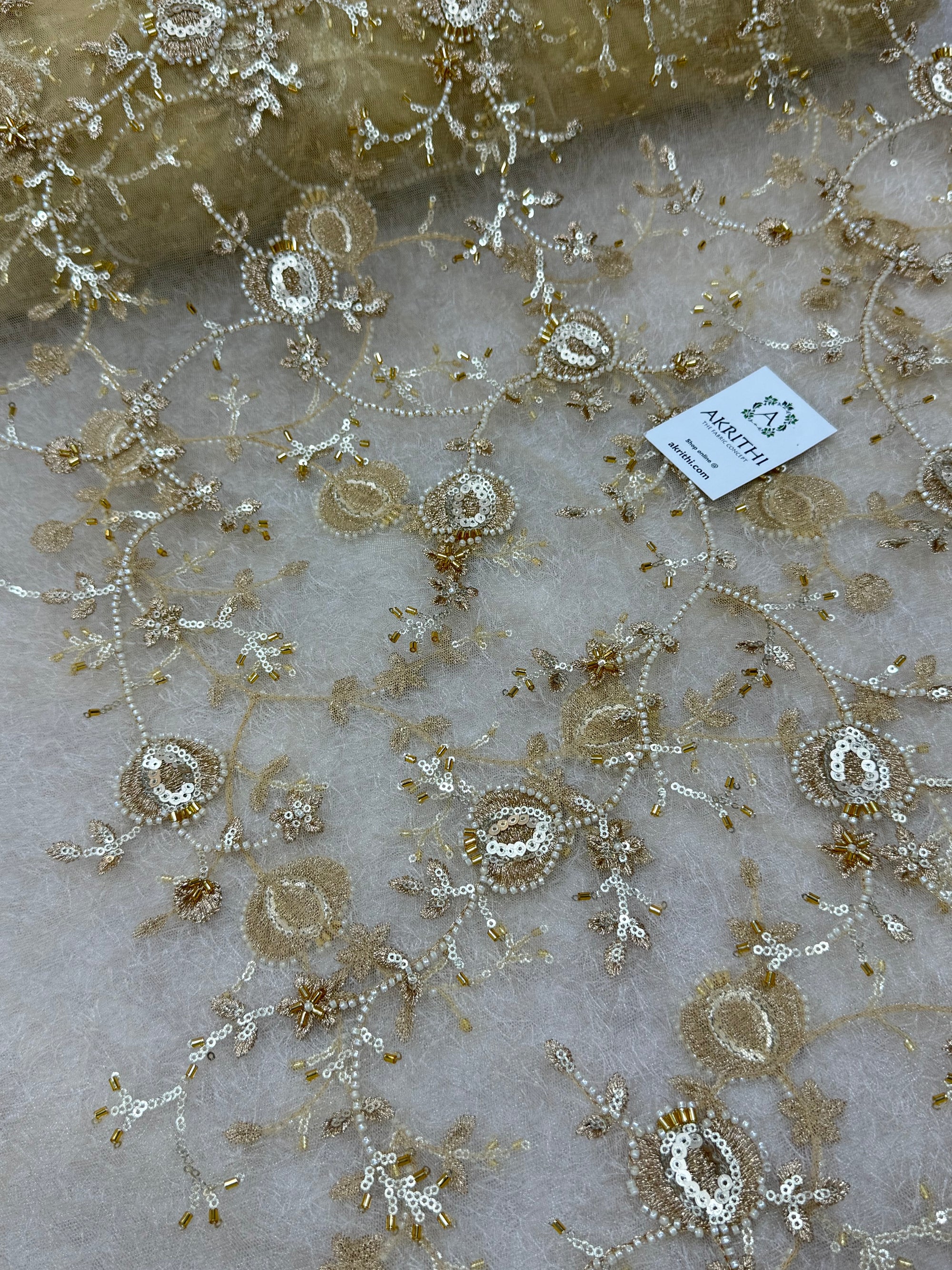Embroidered gold net fabric
