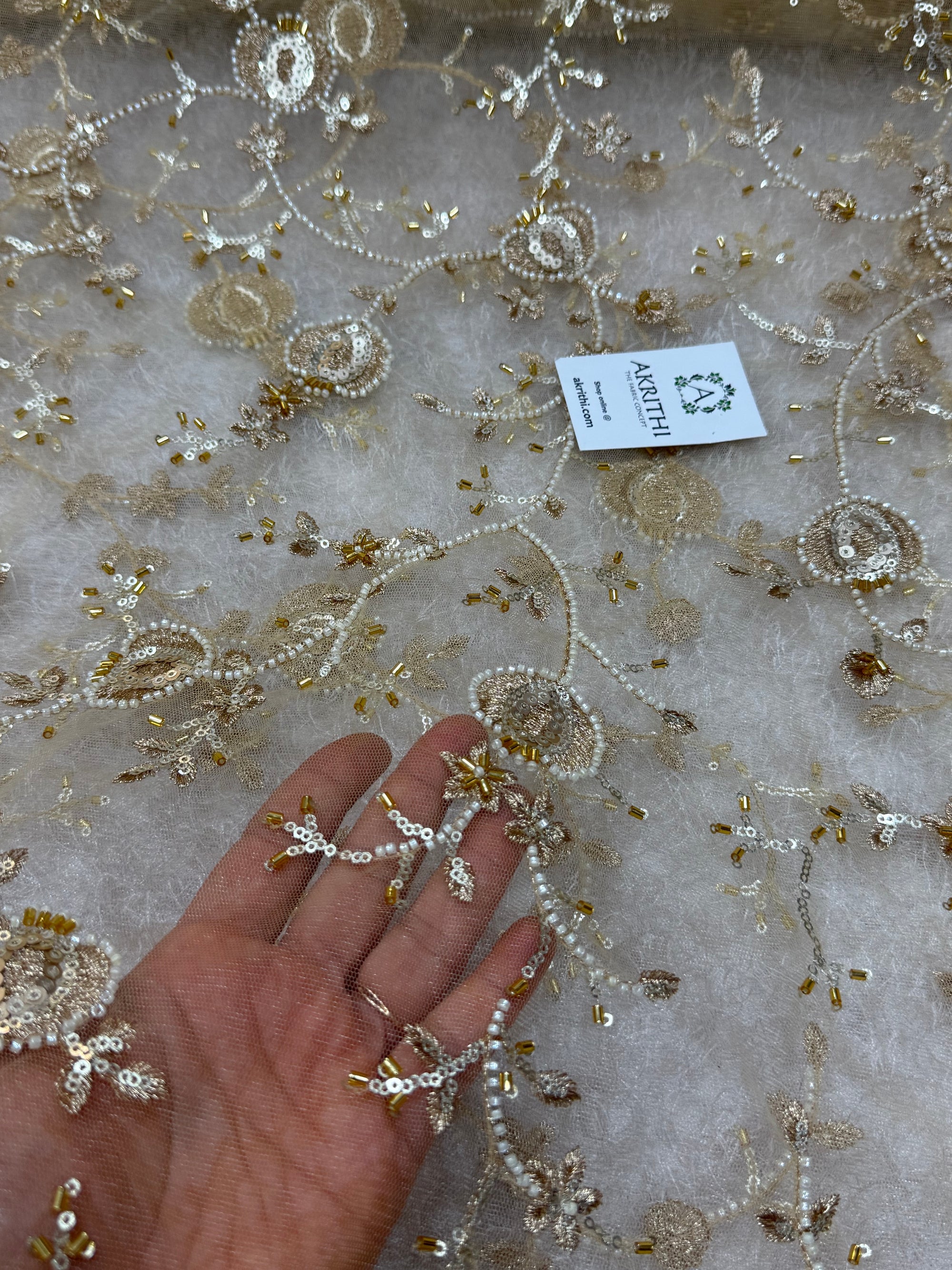Embroidered gold net fabric