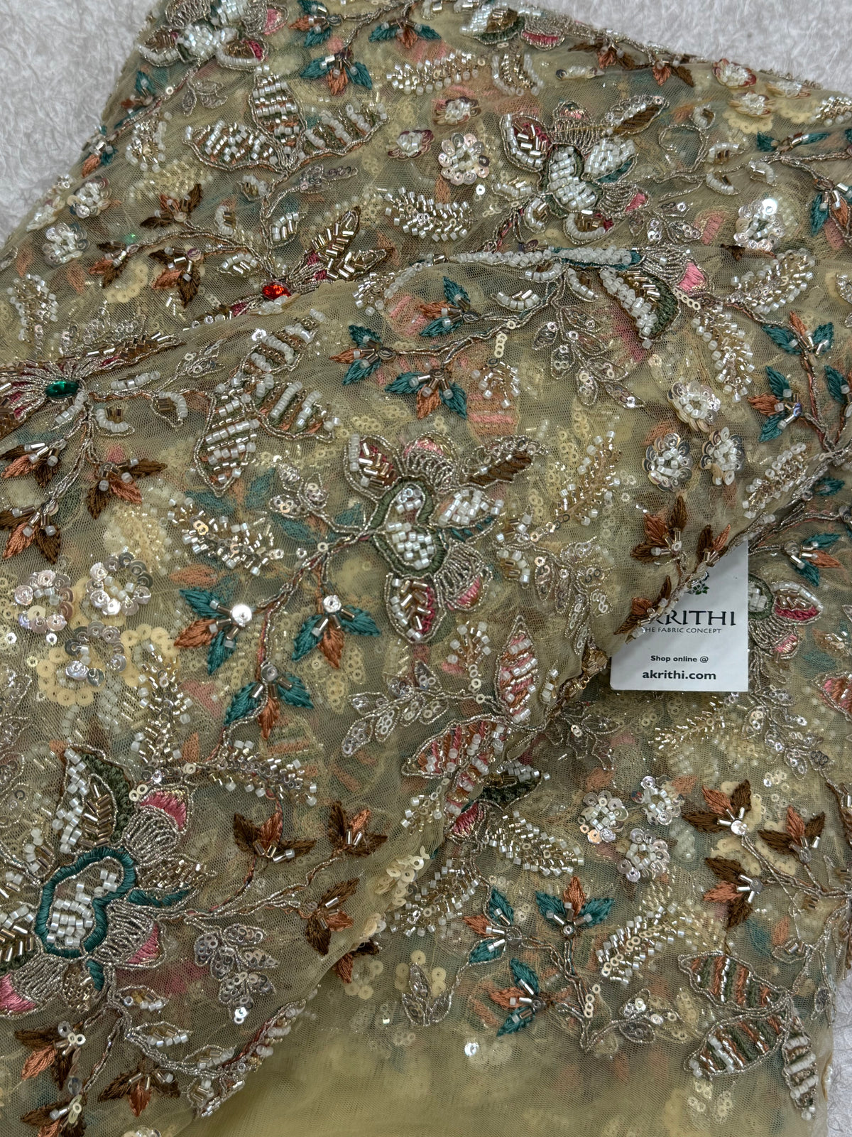Embroidered gold net fabric