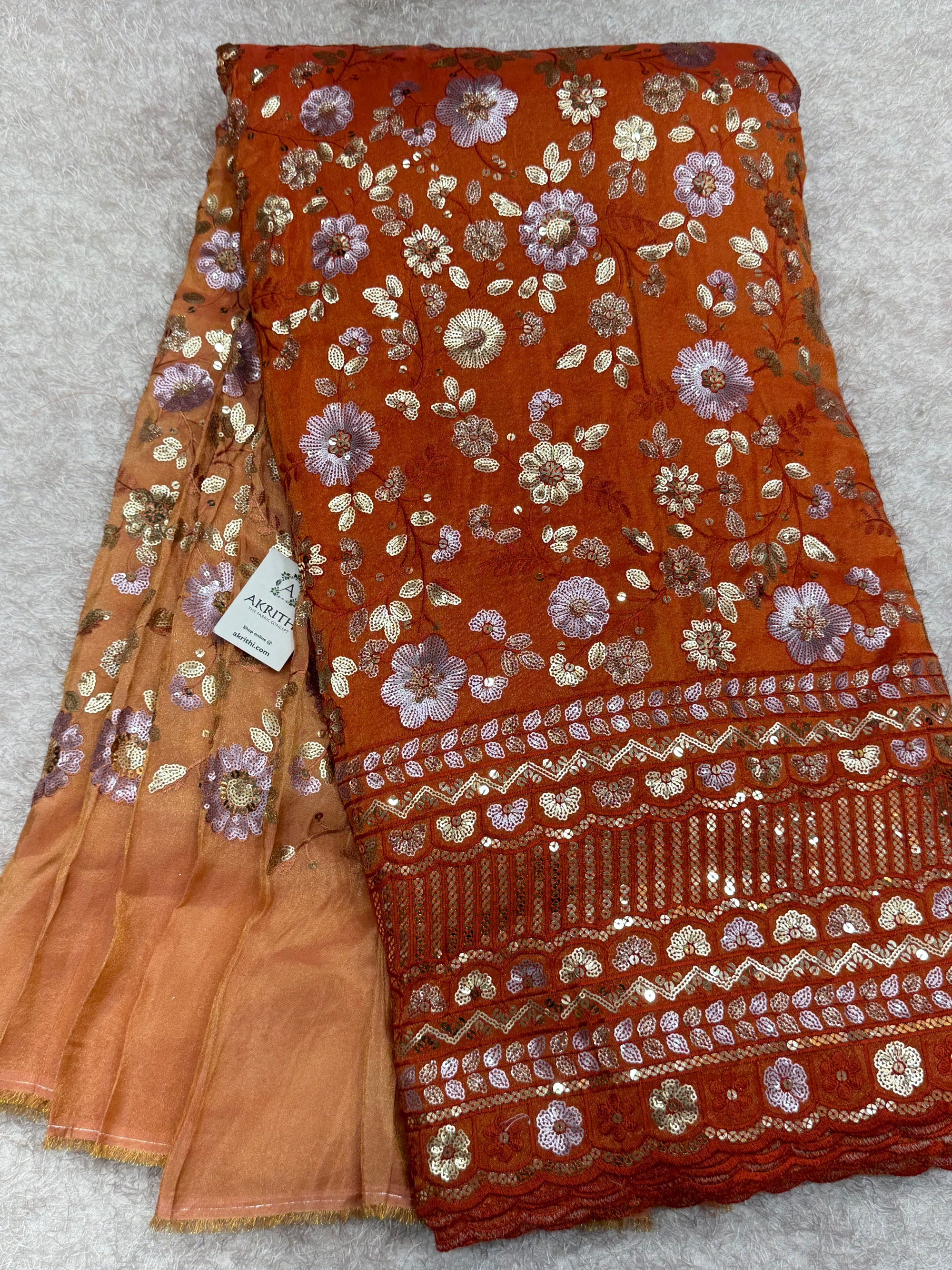 Embroidered tissue crepe fabric