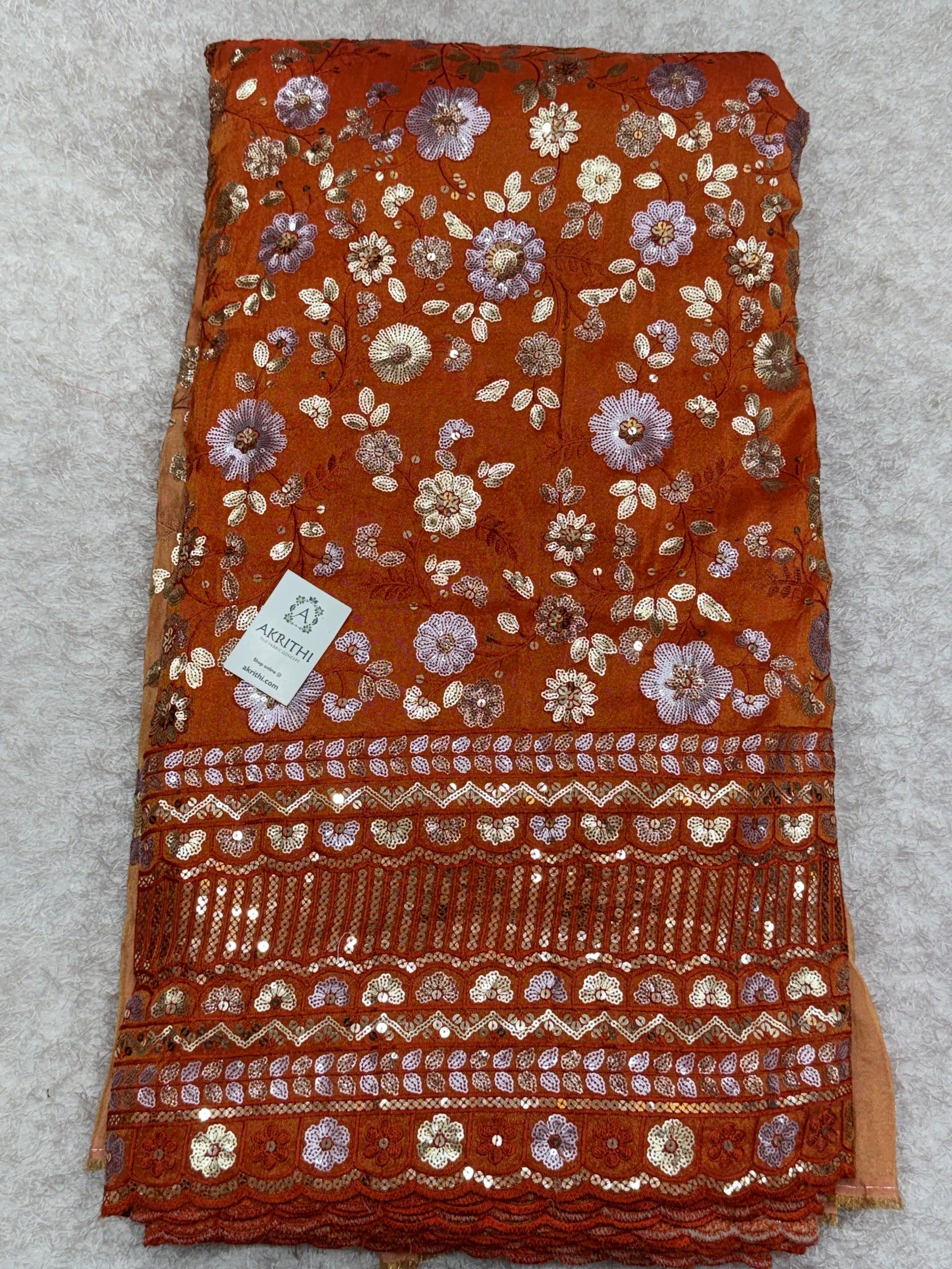 Embroidered tissue crepe fabric