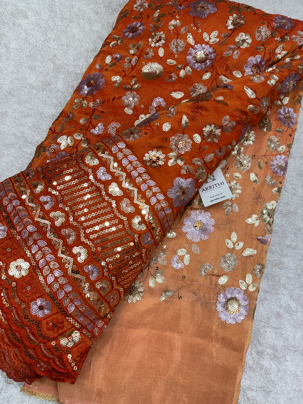 Embroidered tissue crepe fabric