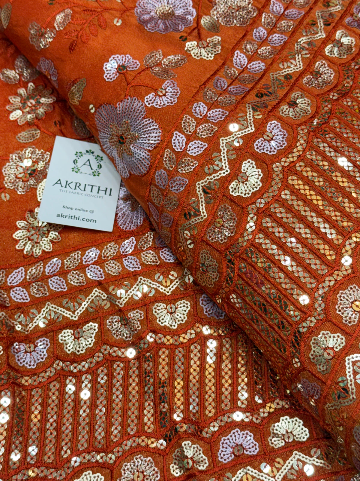 Embroidered tissue crepe fabric