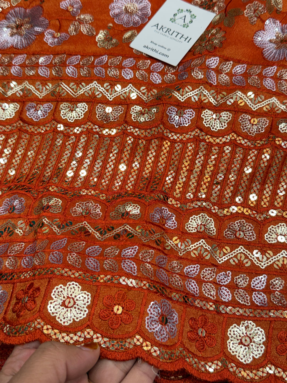 Embroidered tissue crepe fabric