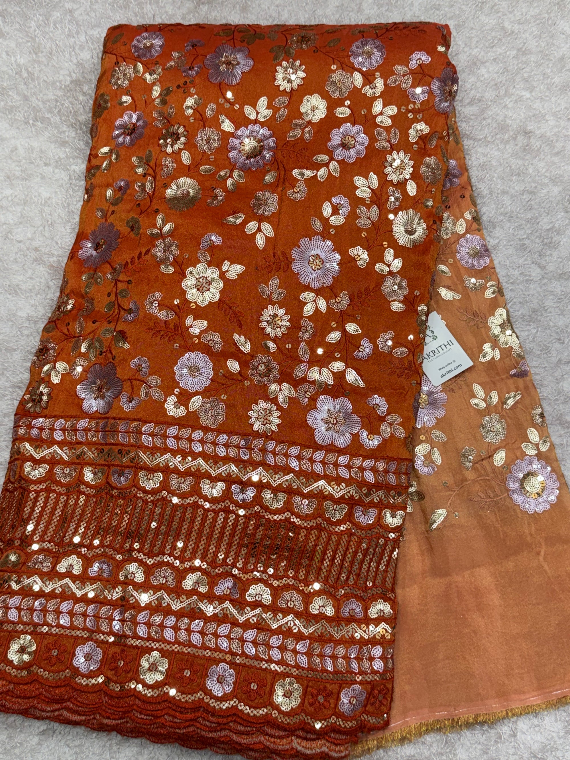 Embroidered tissue crepe fabric