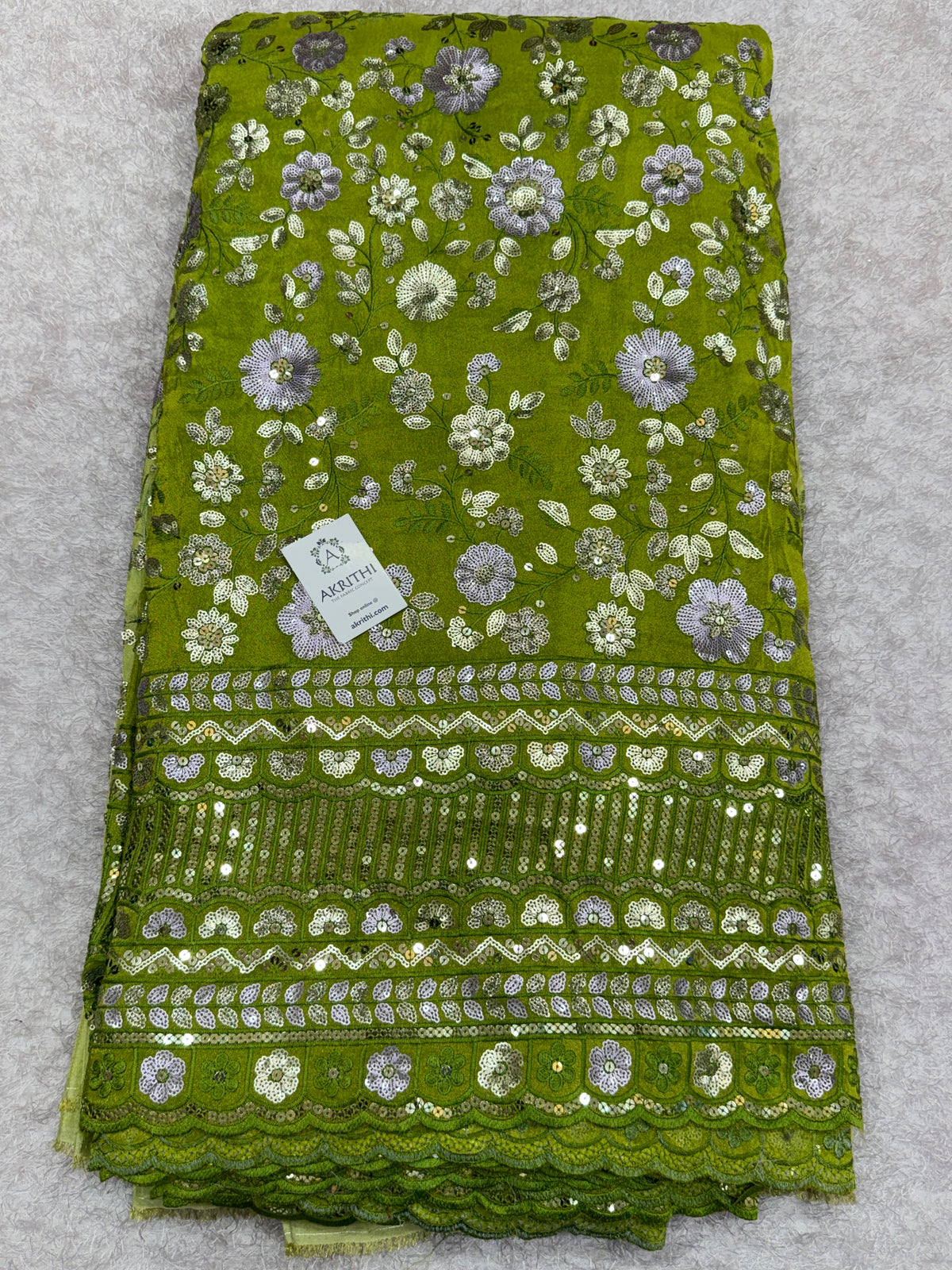 Embroidered tissue crepe fabric