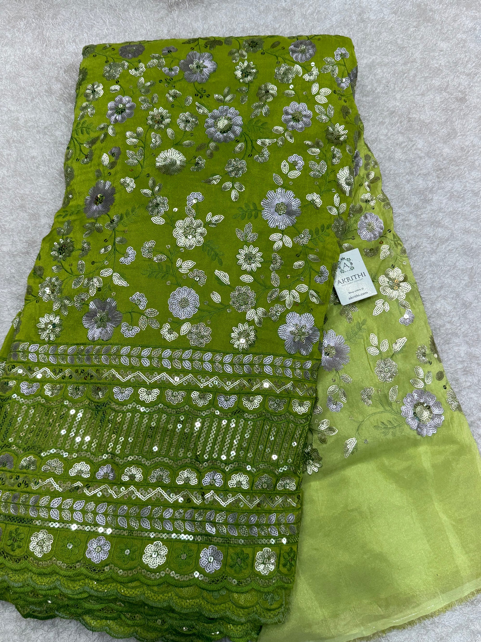Embroidered tissue crepe fabric