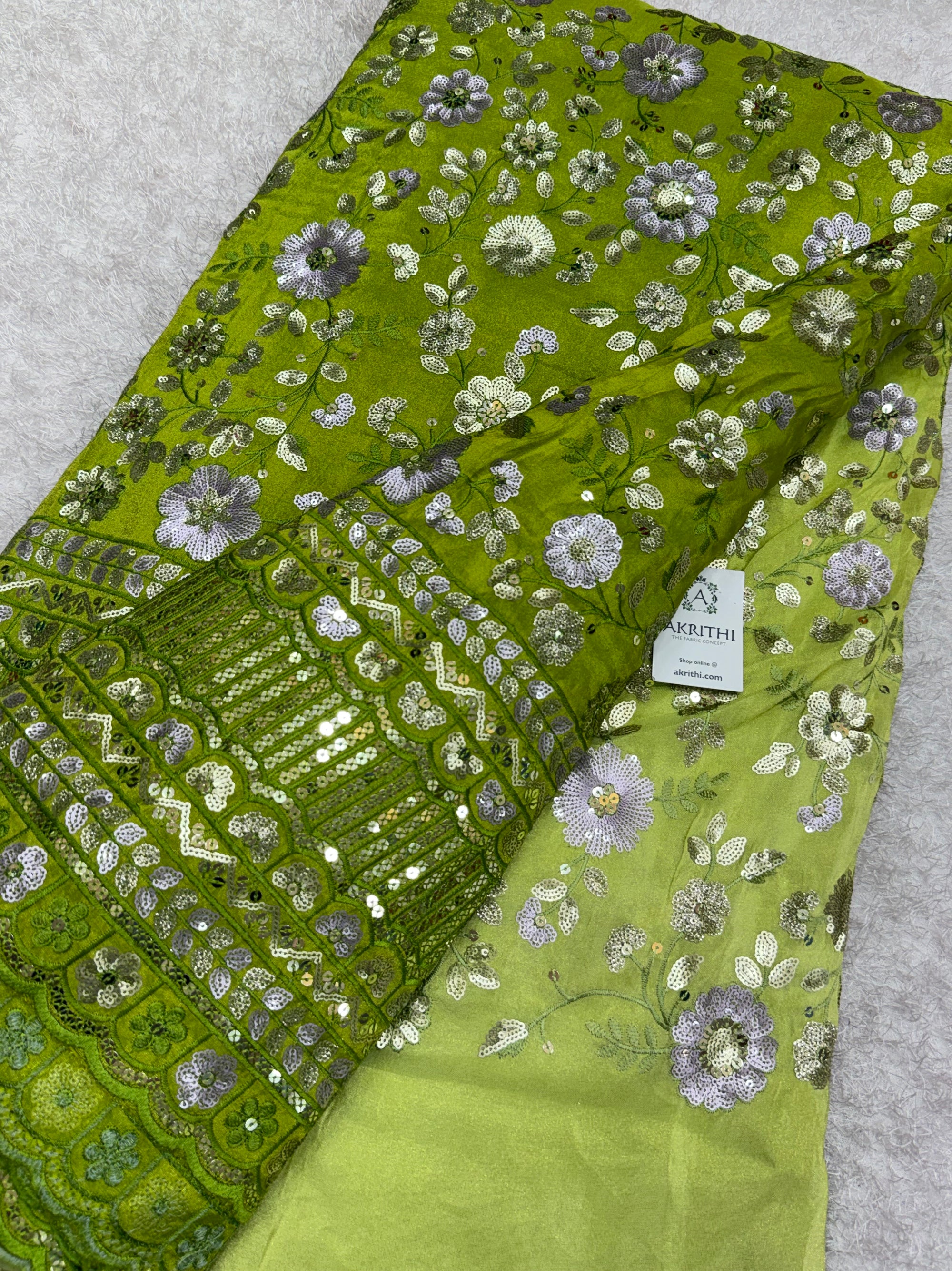 Embroidered tissue crepe fabric