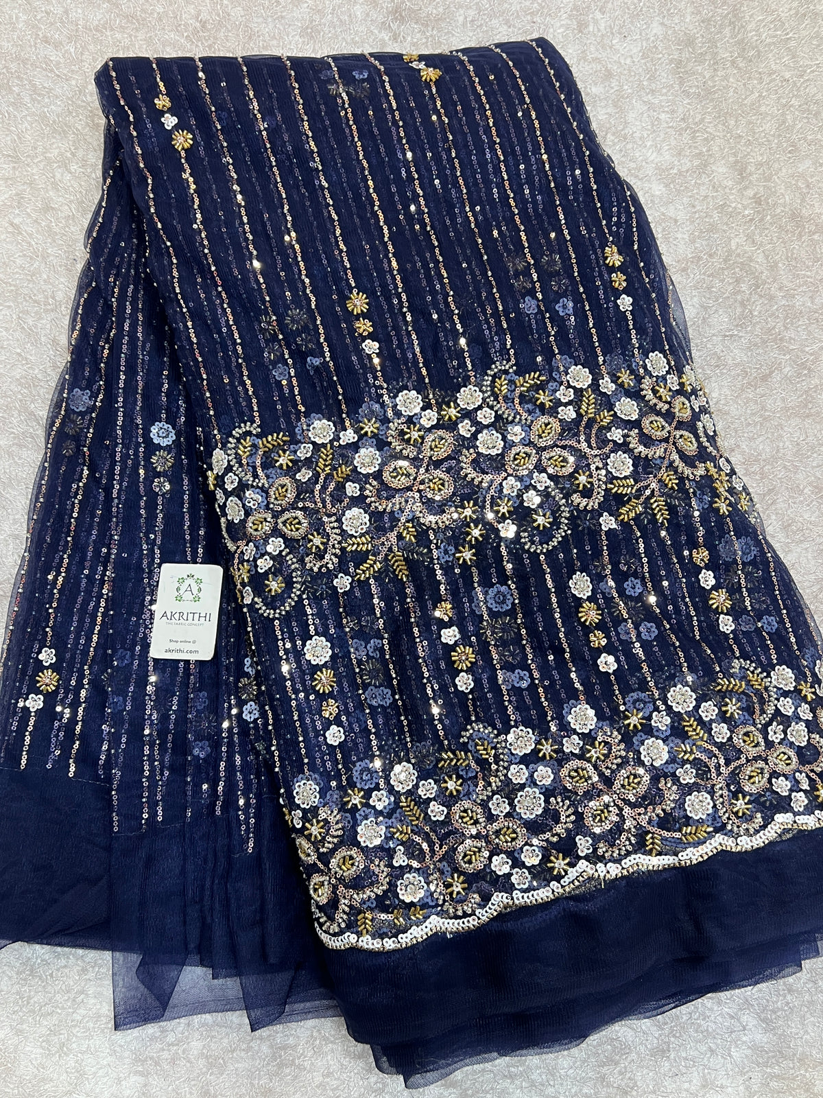 Embroidered net fabric
