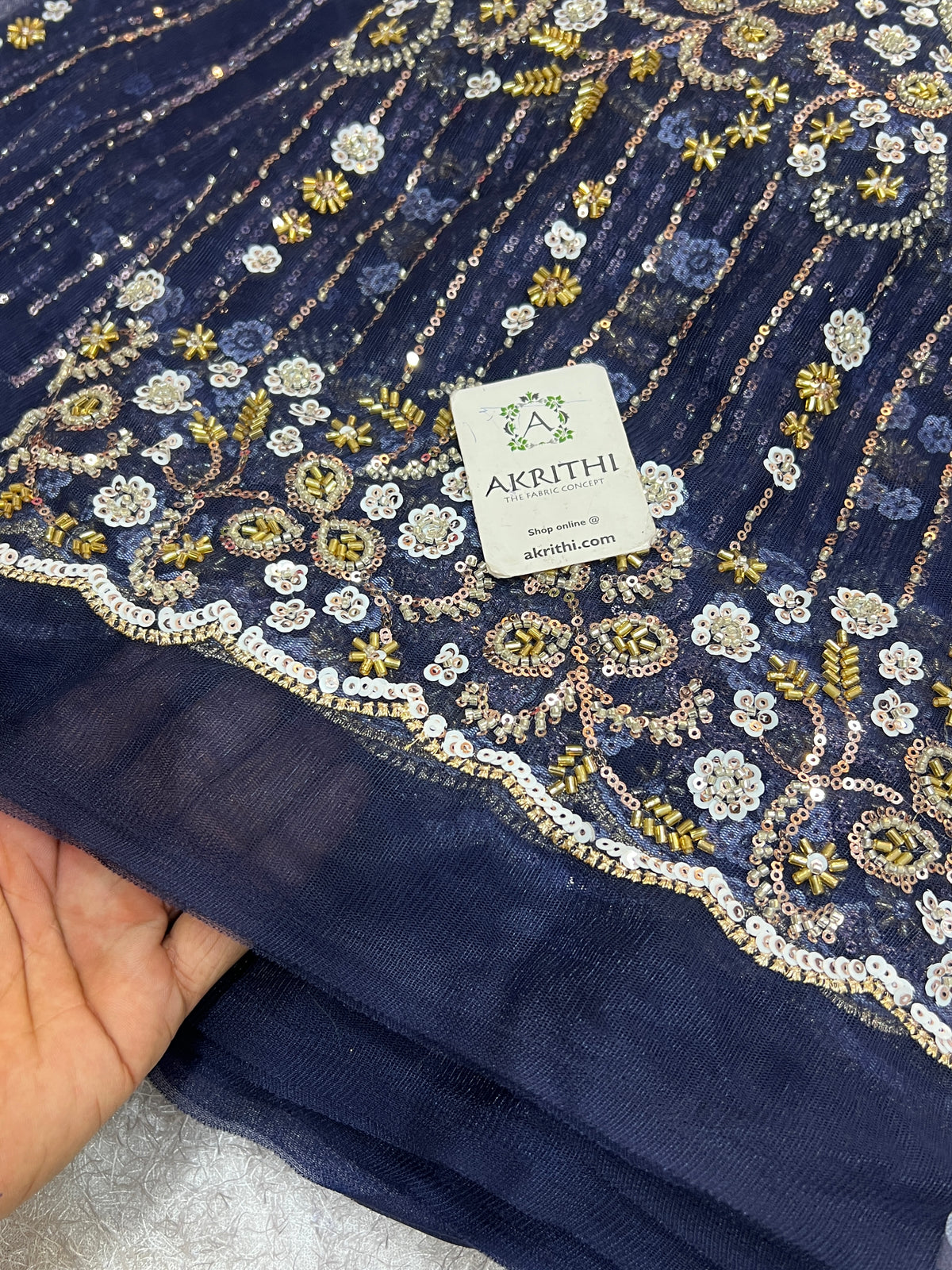 Embroidered net fabric