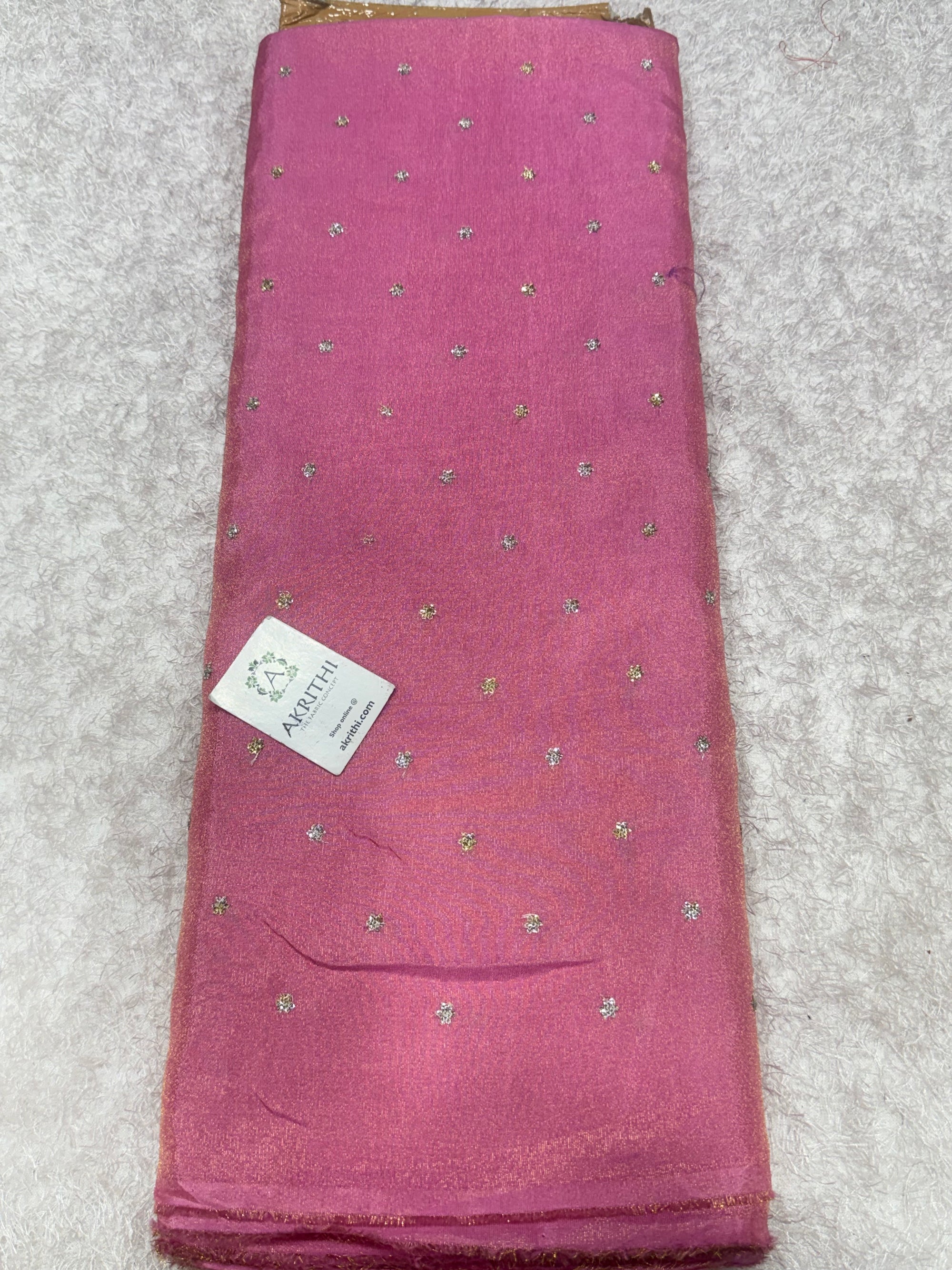 Sequins on tissue crepe fabric