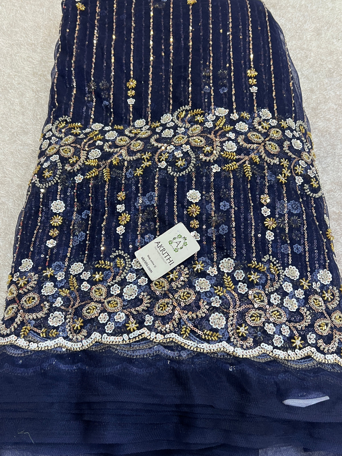Embroidered net fabric
