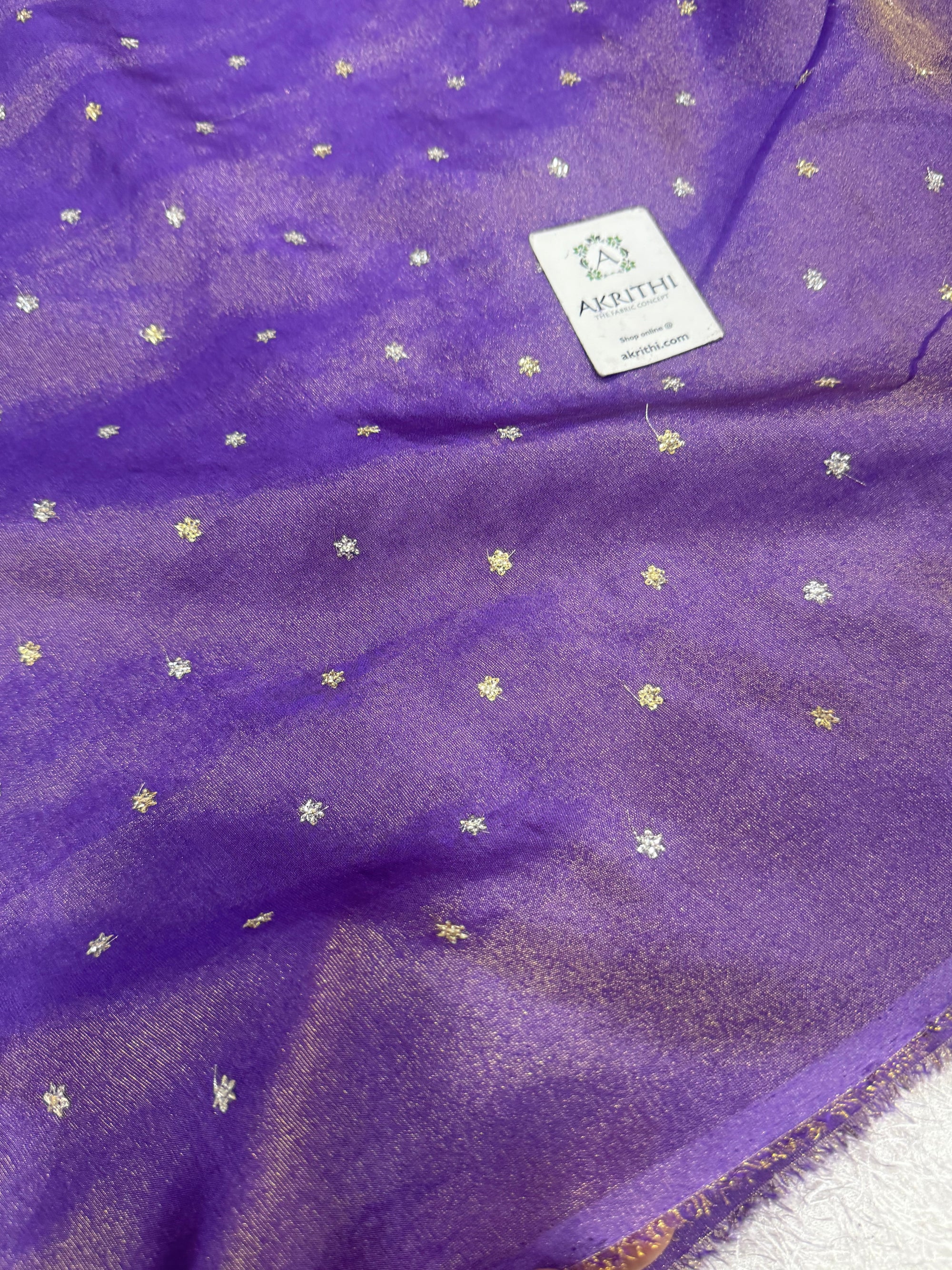 Sequins on tissue crepe fabric