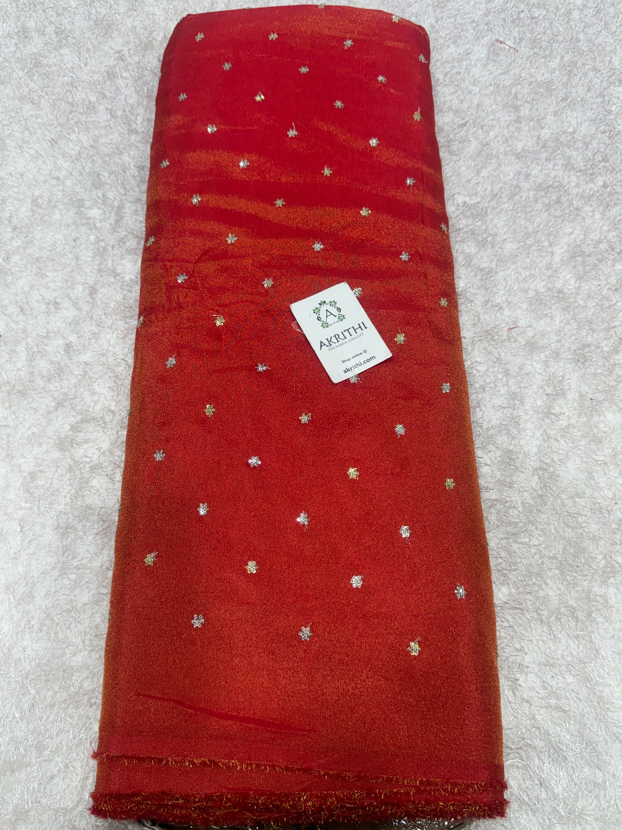 Sequins on tissue crepe fabric