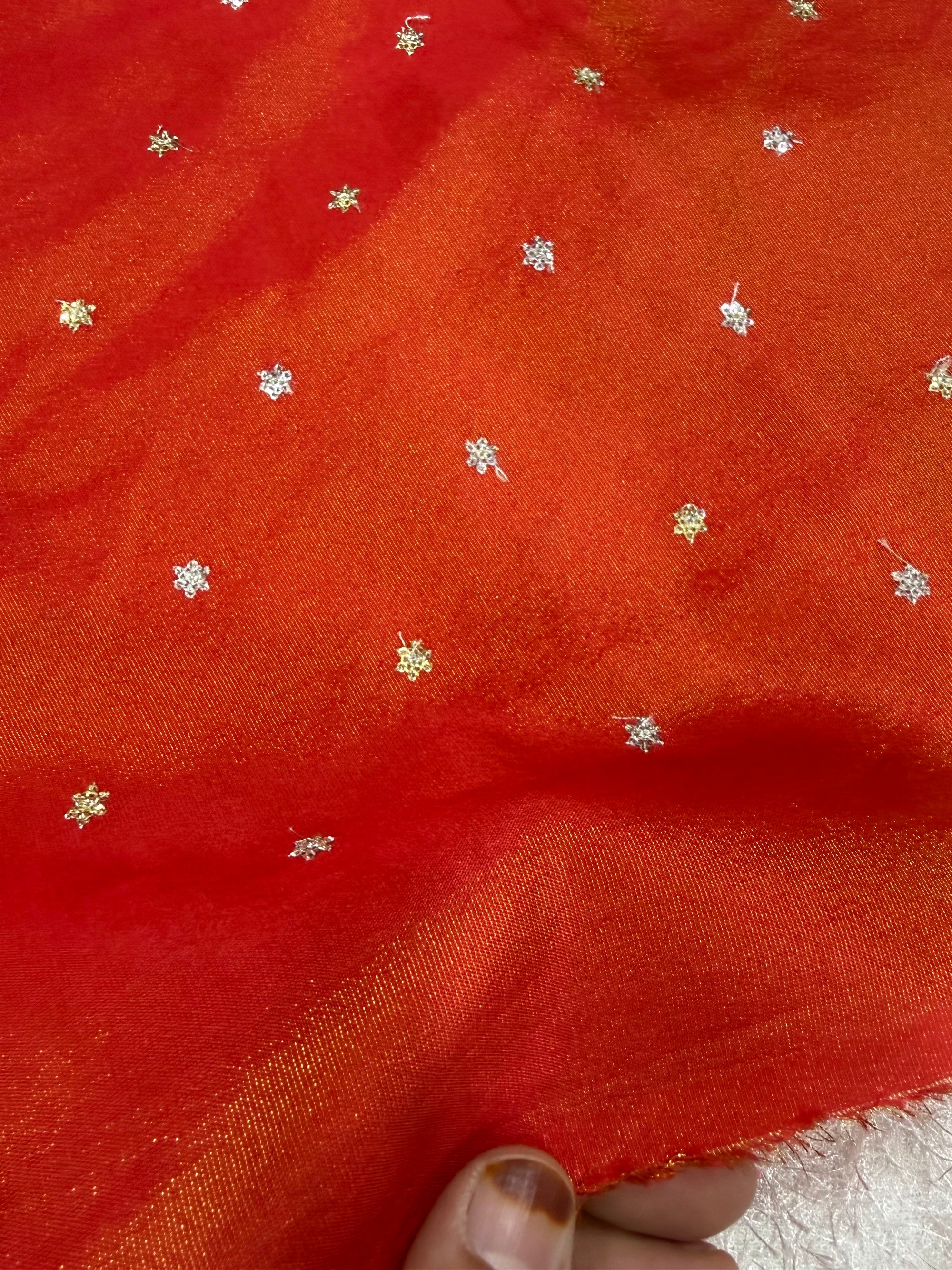 Sequins on tissue crepe fabric
